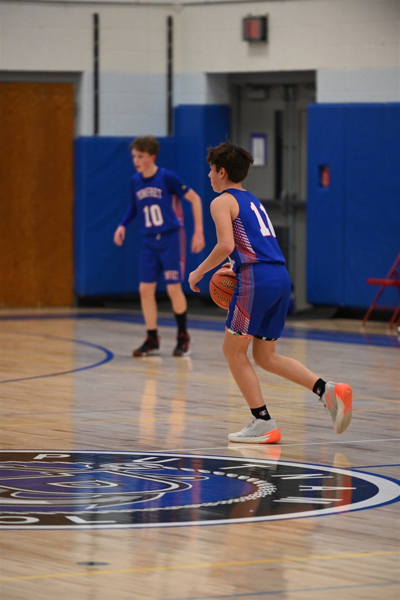 member of the 2023-24 boys basketball team on the court