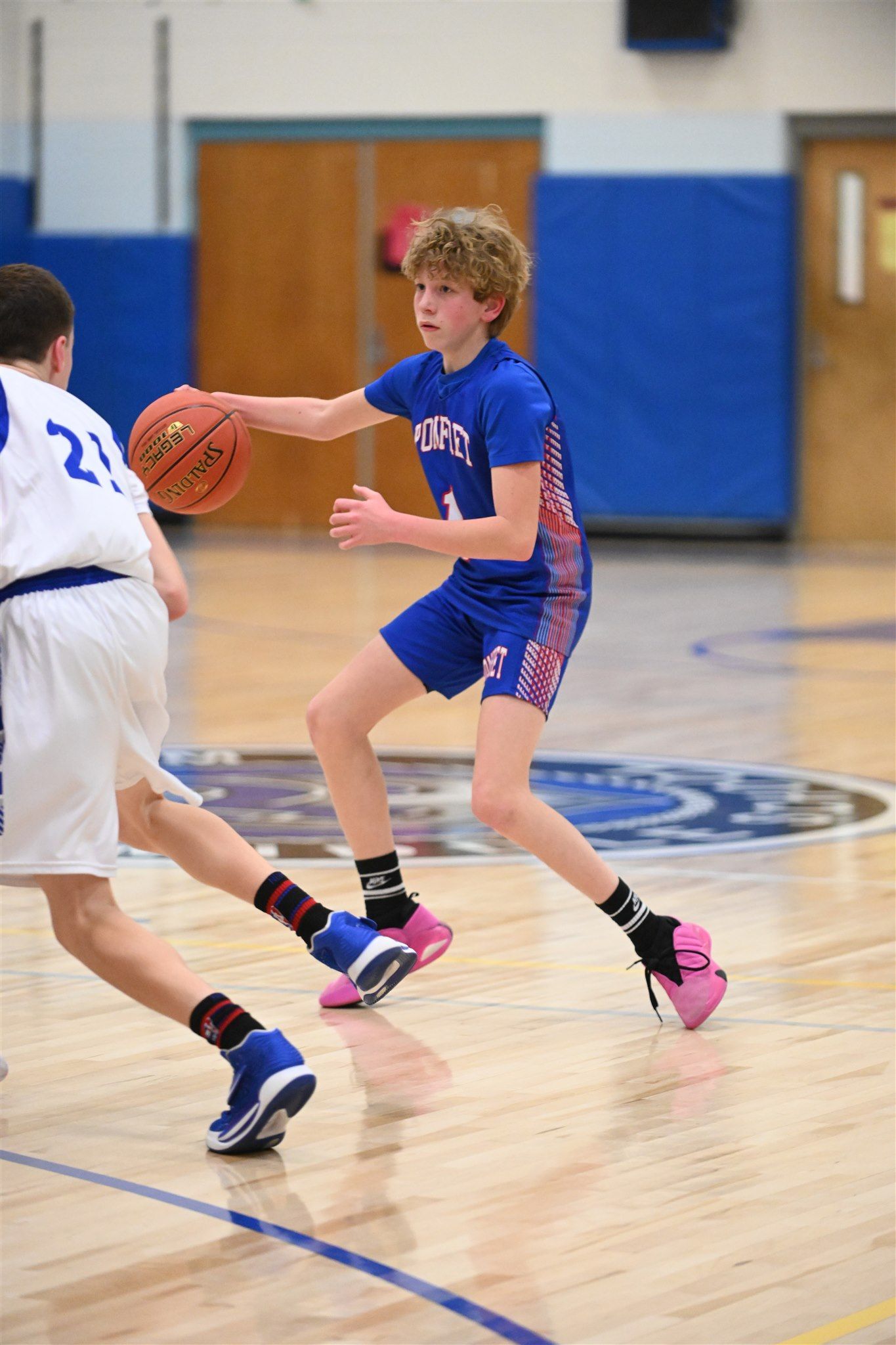 Members of the 2023-24 boys basketball team in action