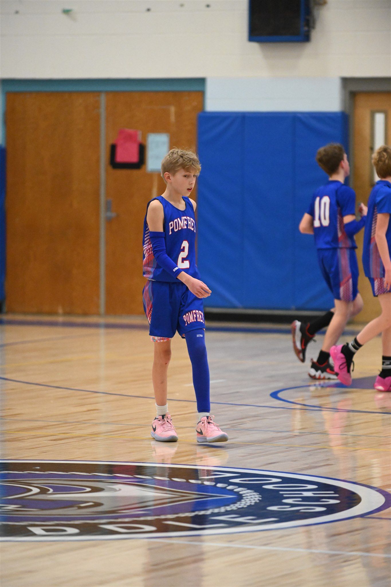 member of the 2023-24 boys basketball team on the court