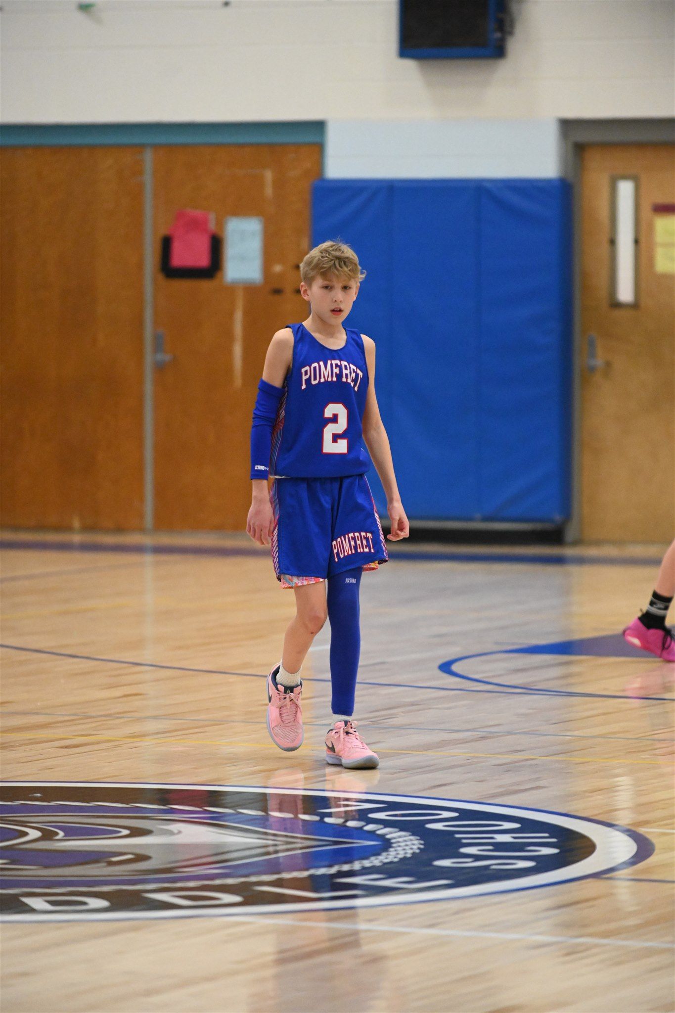 member of the 2023-24 boys basketball team on the court