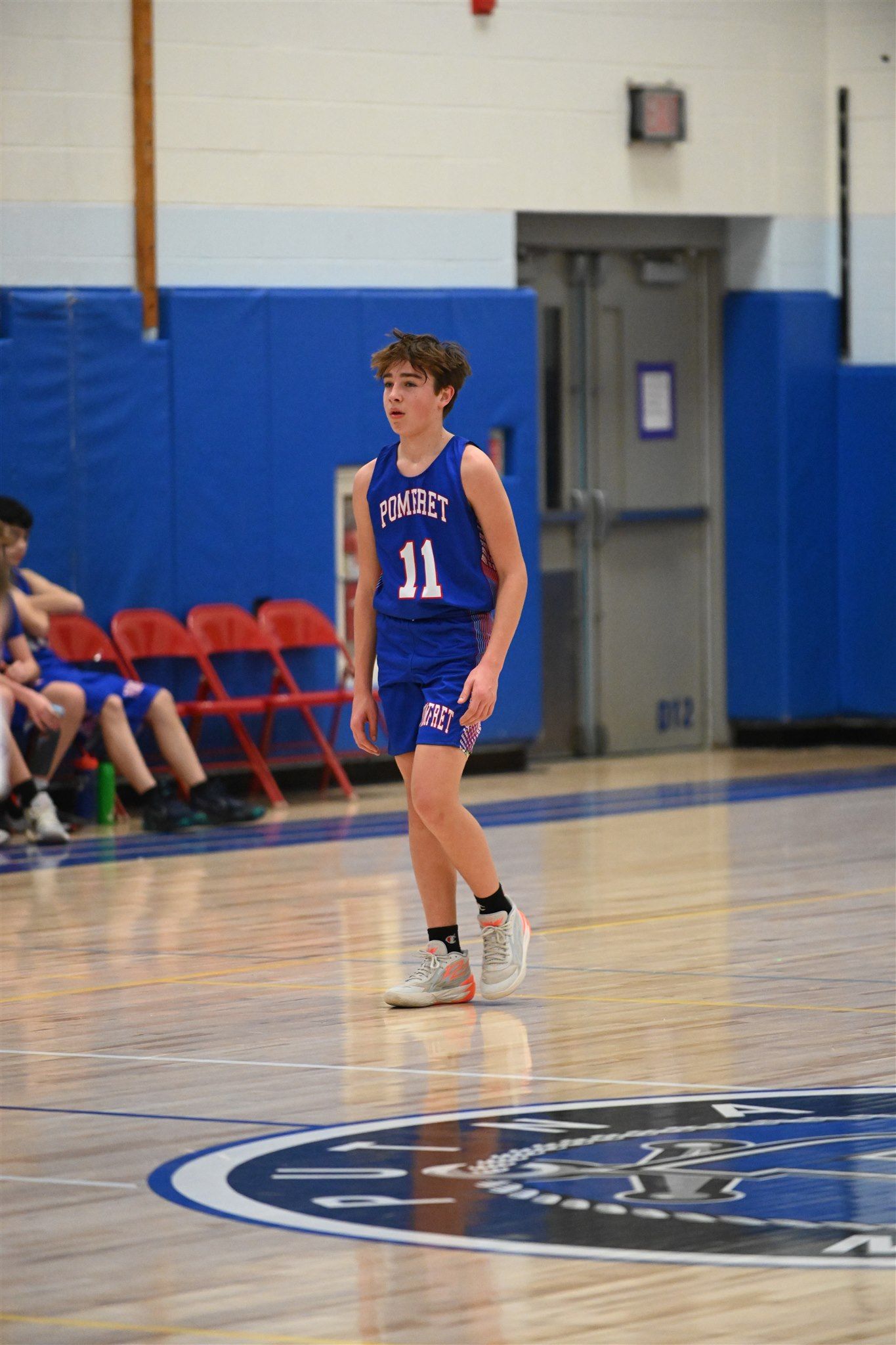 member of the 2023-24 boys basketball team on the court