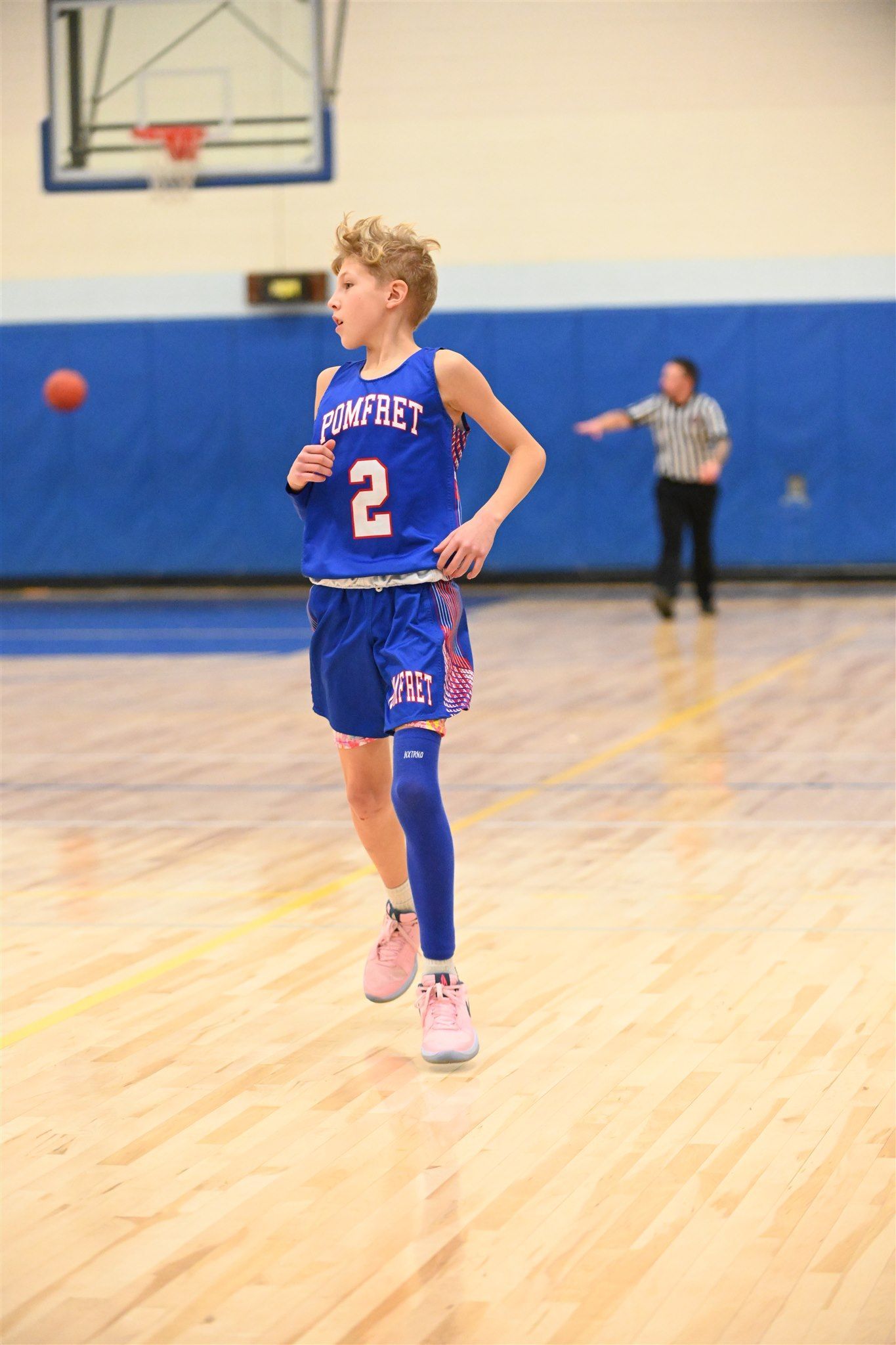 member of the 2023-24 boys basketball team on the court