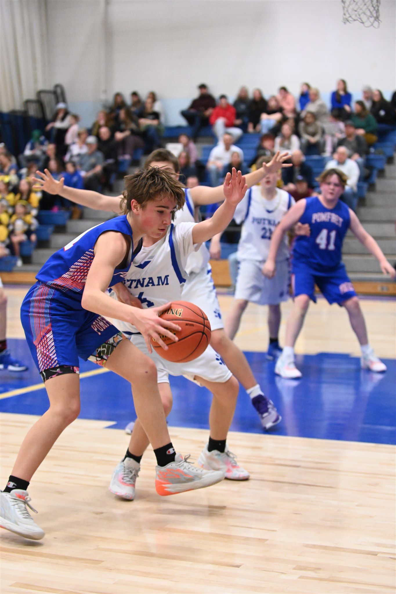 members of the 2023-24 boys basketball team on the court