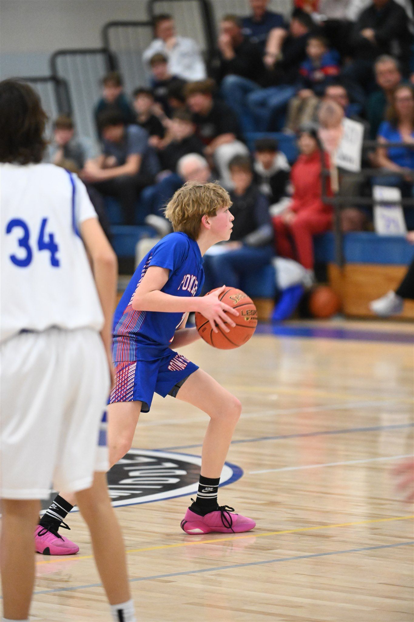 member of the 2023-24 boys basketball team on the court