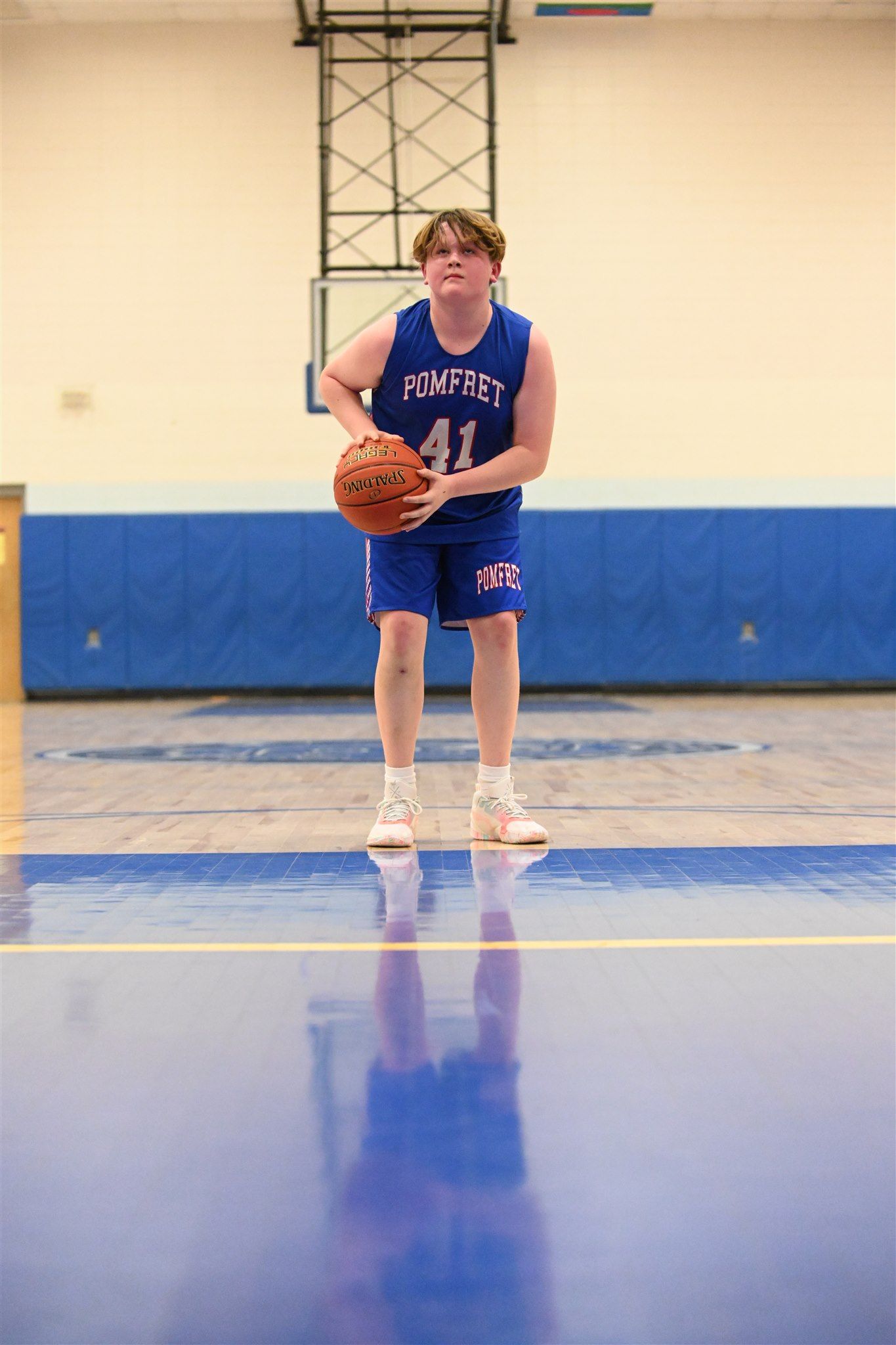 member of the 2023-24 boys basketball team on the court