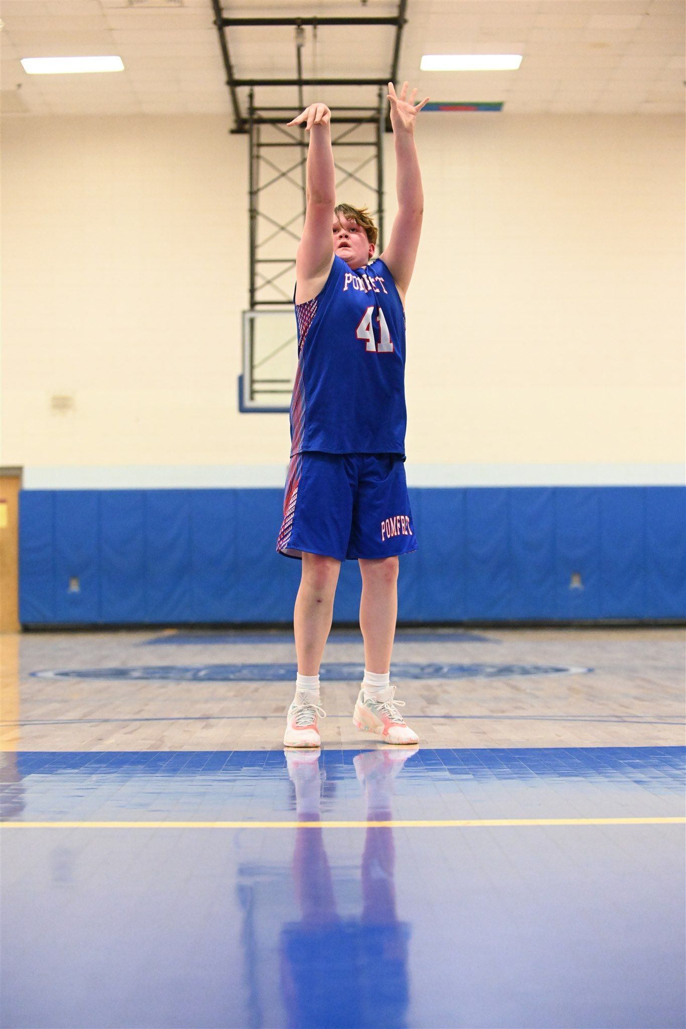 member of the 2023-24 boys basketball team on the court