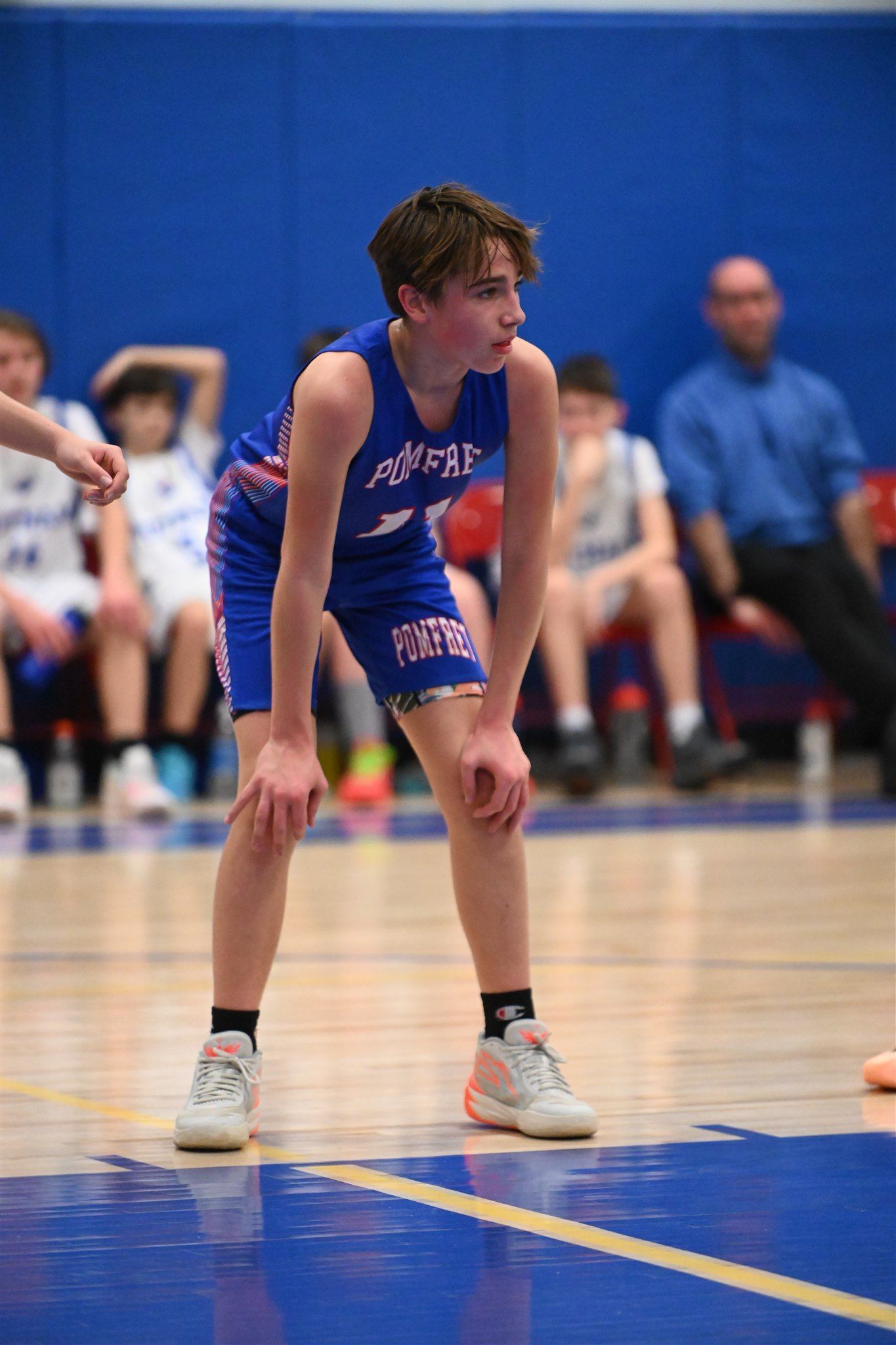 member of the 2023-24 boys basketball team on the court