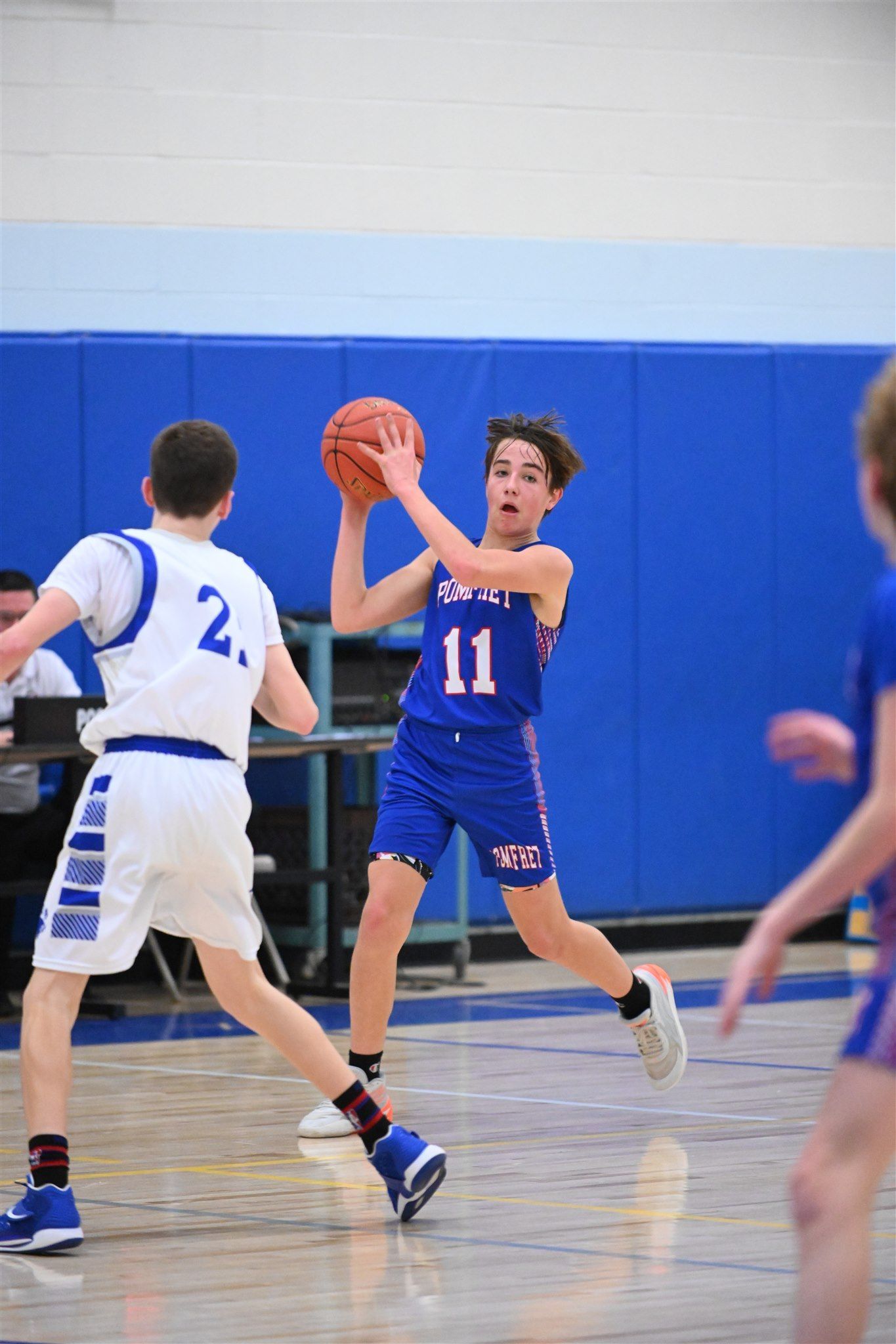 member of the 2023-24 boys basketball team on the court