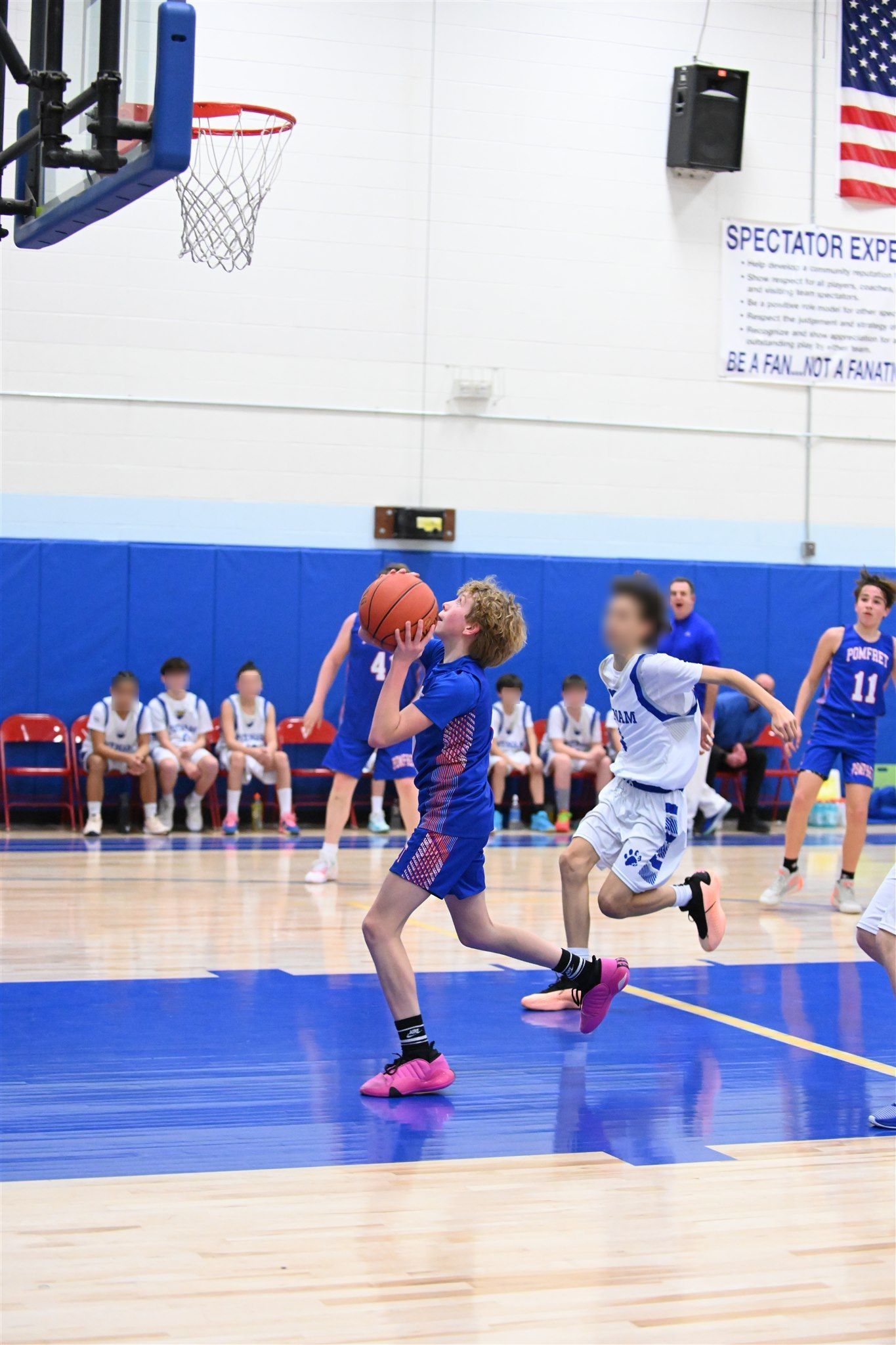 members of the 2023-24 boys basketball team on the court