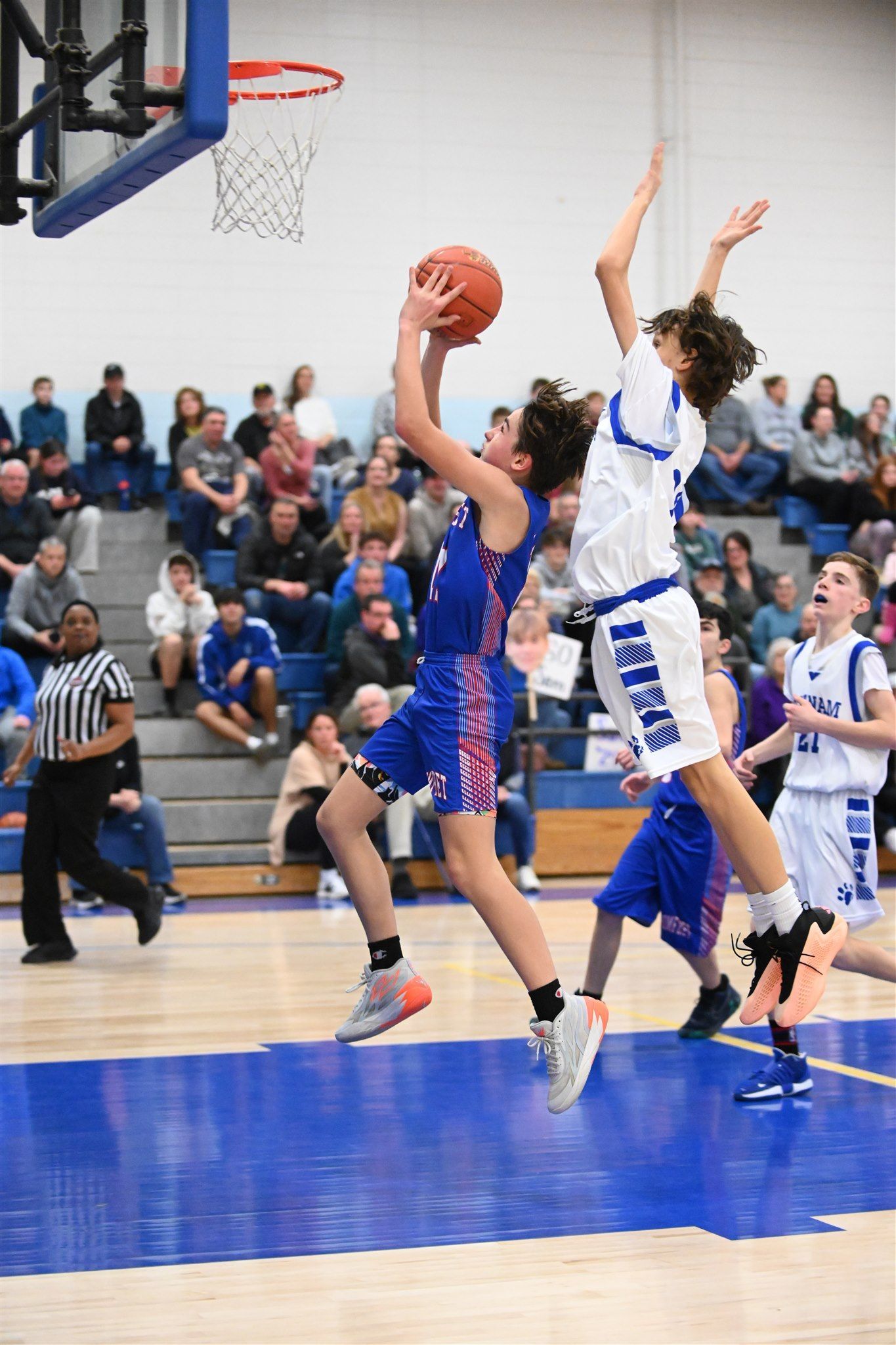 members of the 2023-24 boys basketball team on the court