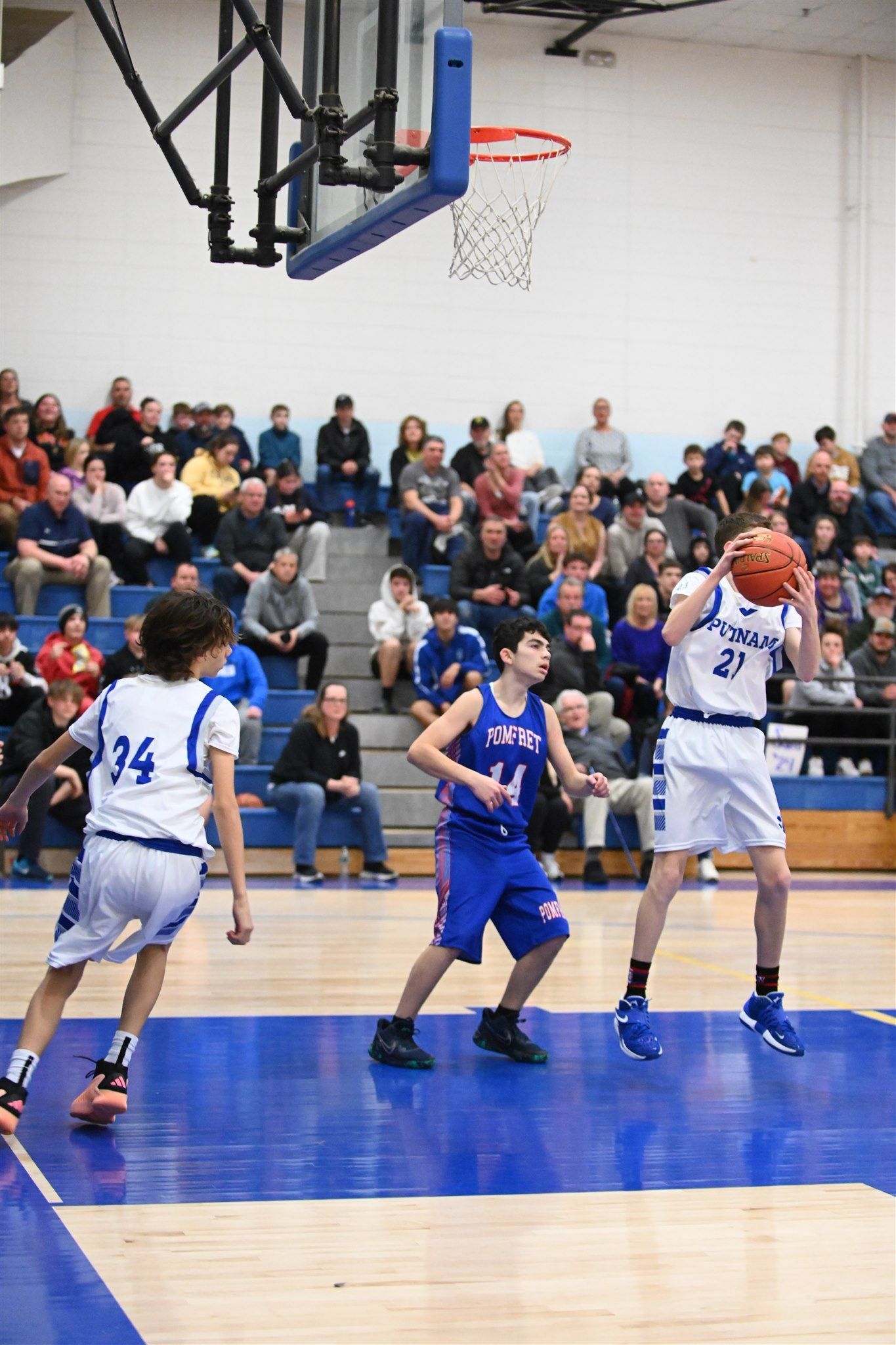 member of the 2023-24 boys basketball team on the court