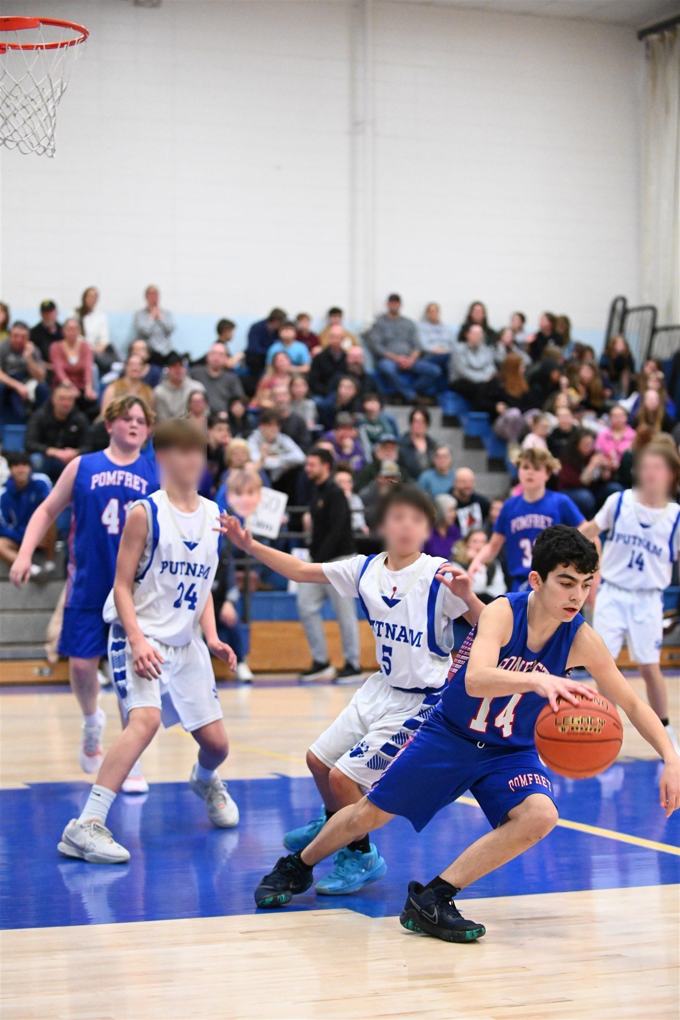 members of the 2023-24 boys basketball team on the court