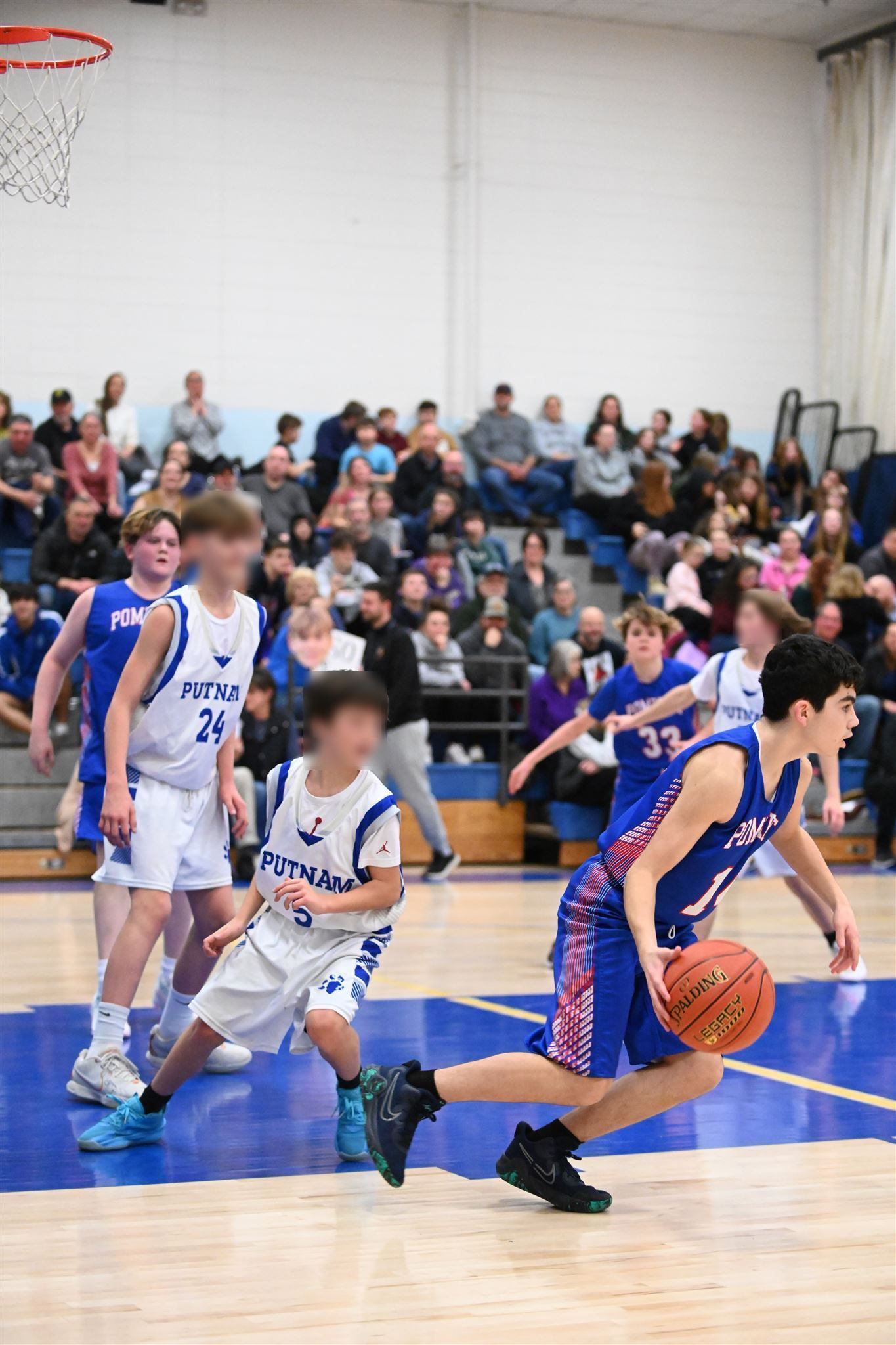 member of the 2023-24 boys basketball team on the court