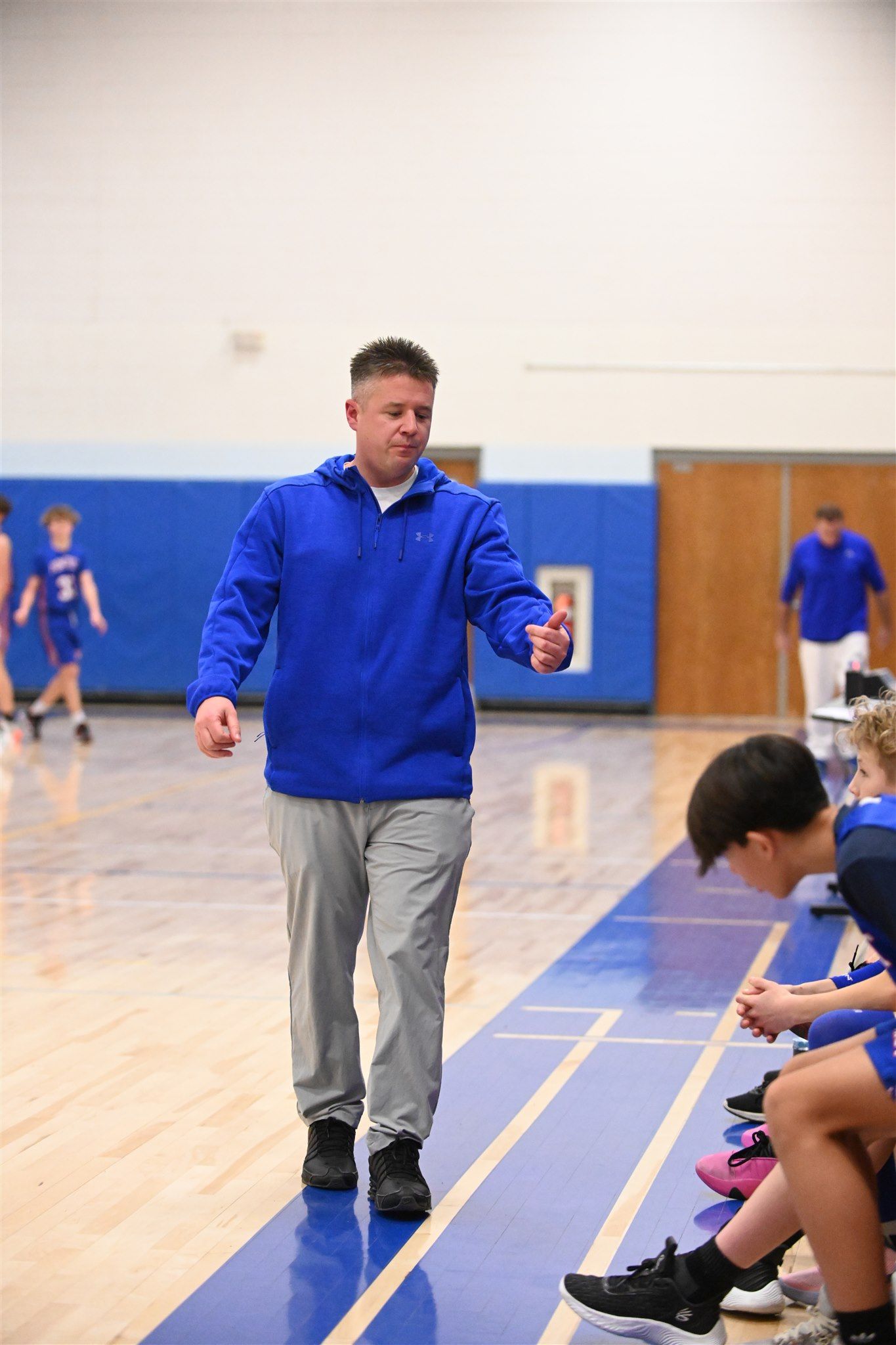 coach  of the 2023-24 boys basketball team on the court