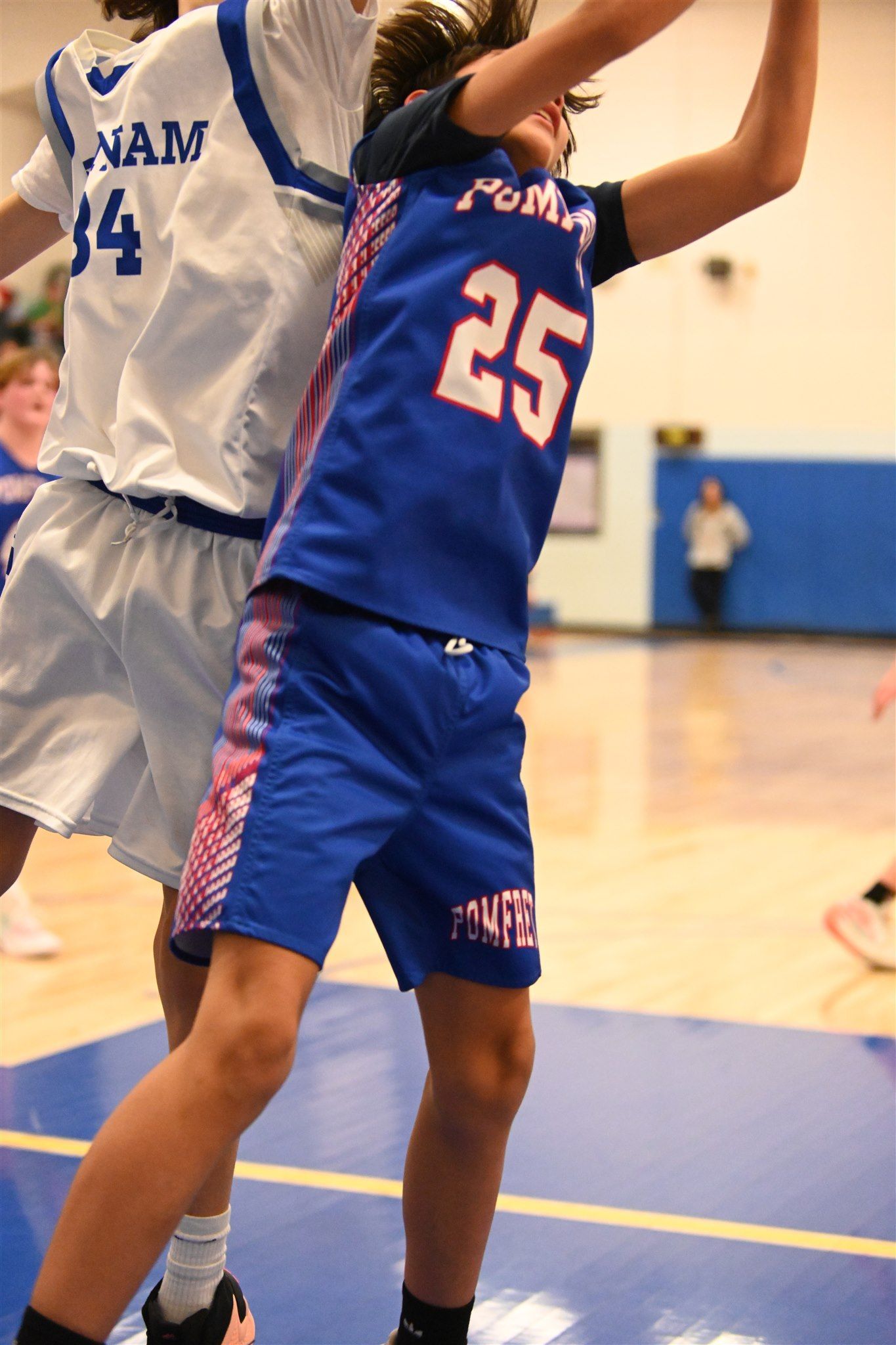 member of the 2023-24 boys basketball team on the court