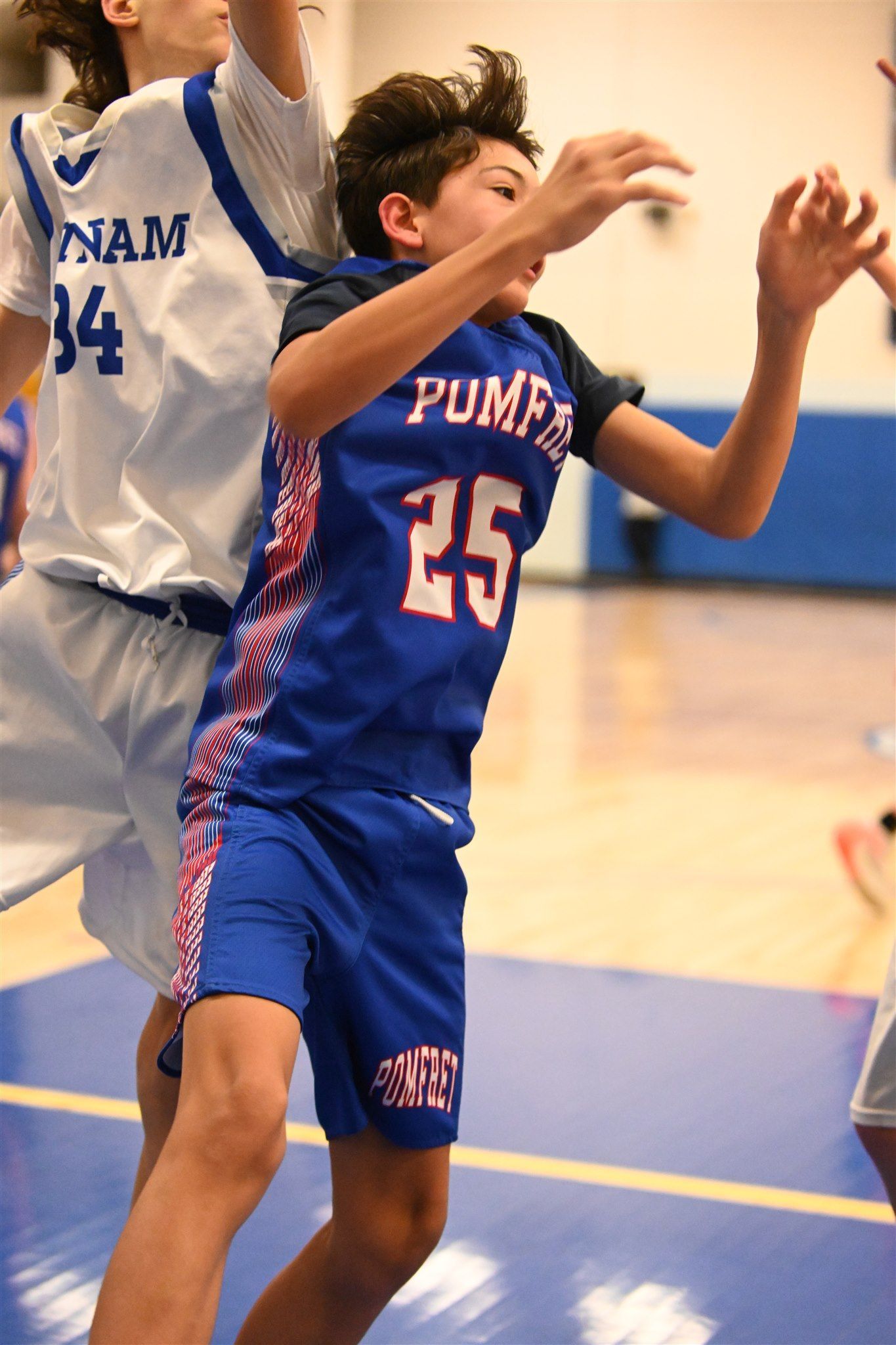 member of the 2023-24 boys basketball team on the court