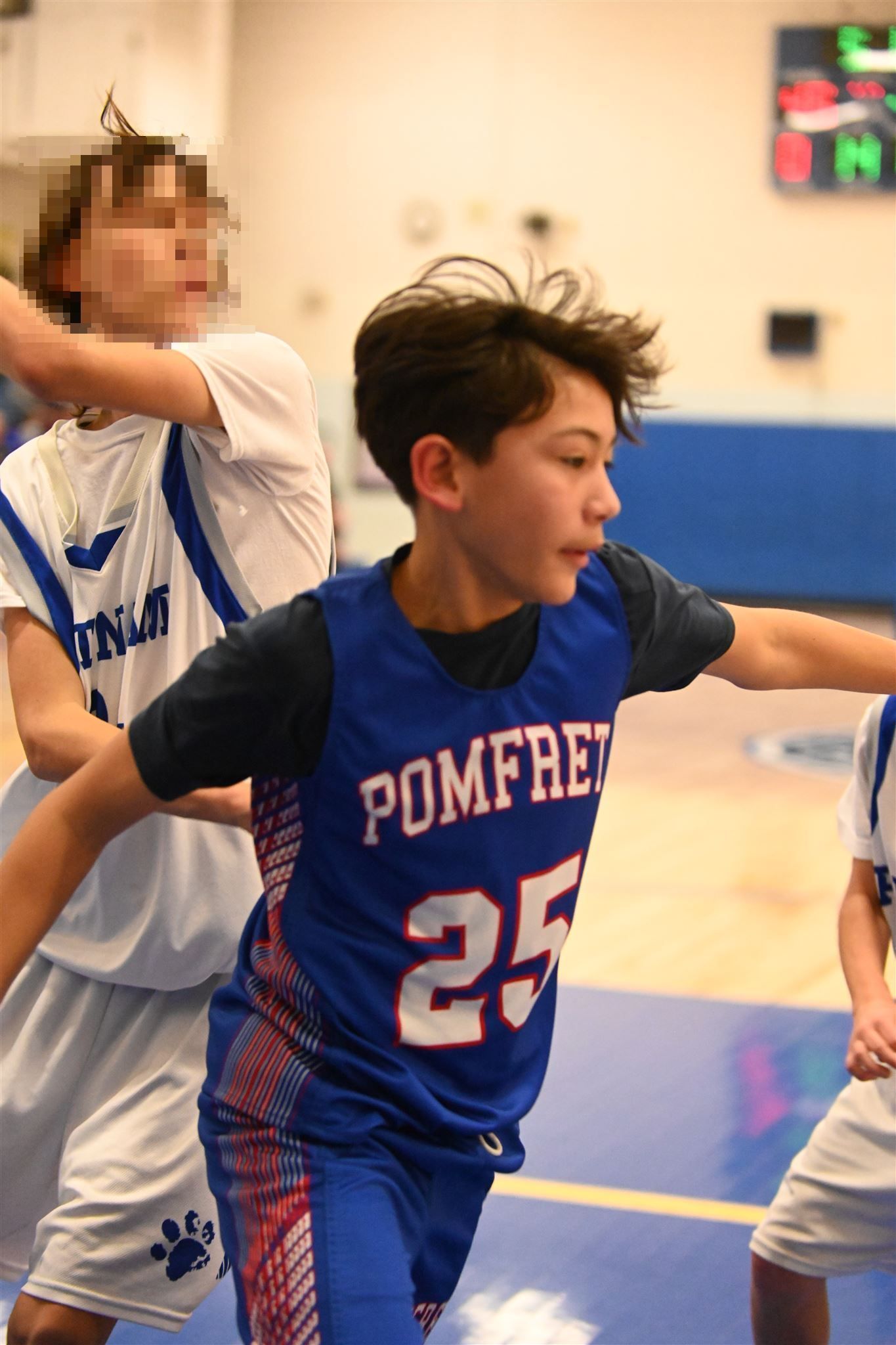 member of the 2023-24 boys basketball team on the court