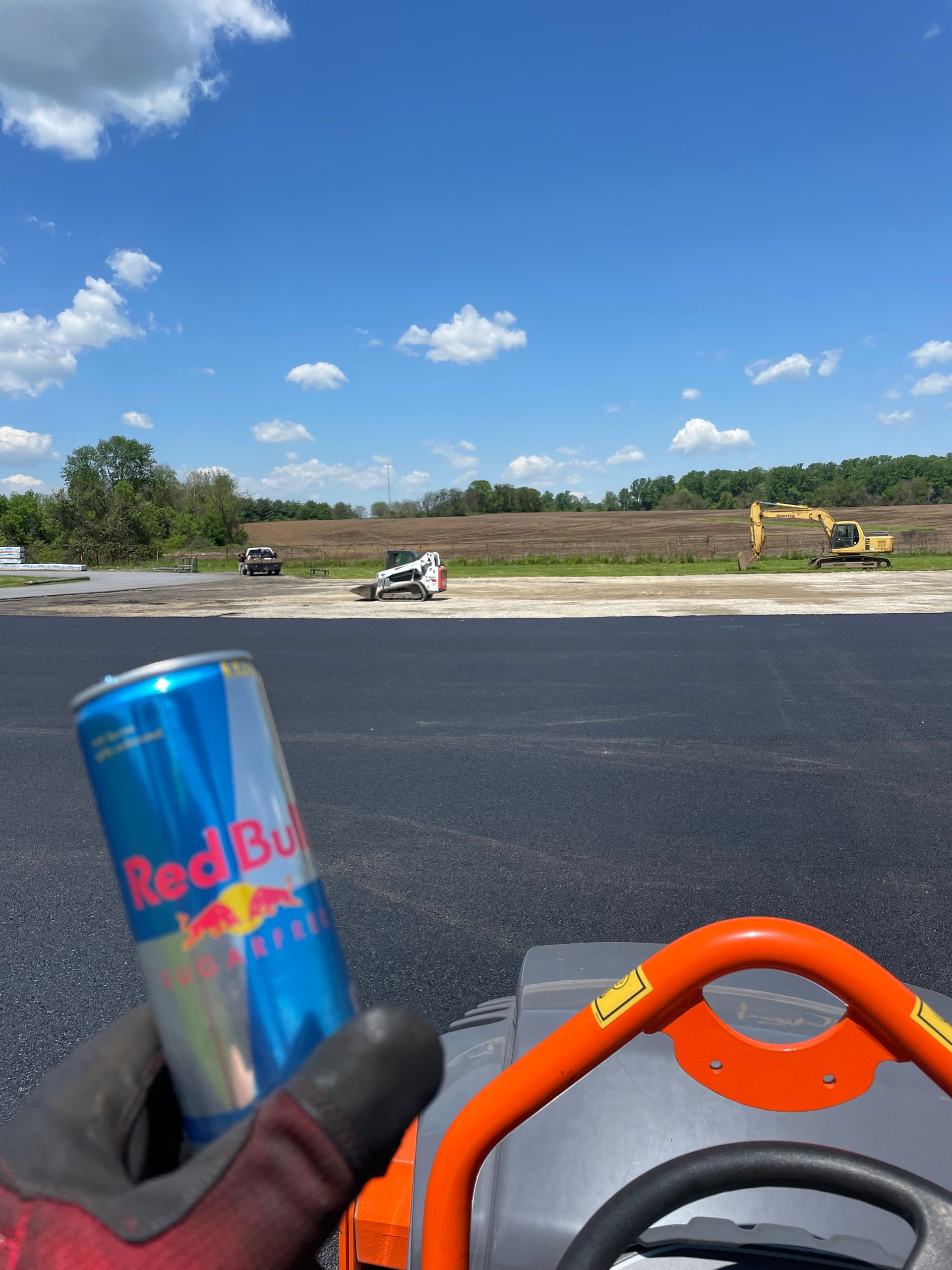 Asphalt Paving in an Open Field with Red Bull — Wilmington, DE — Driveway Man LLC