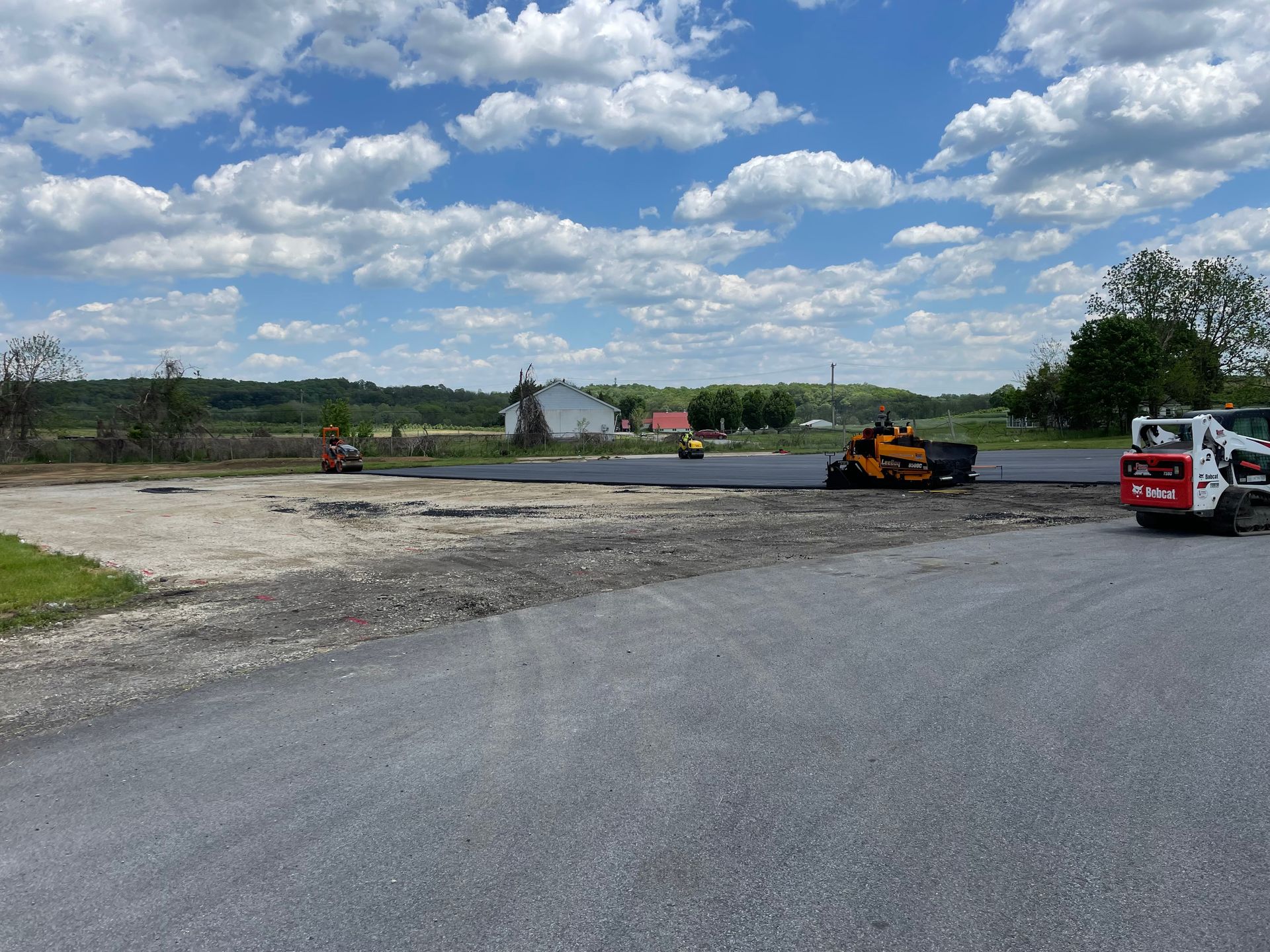 Open Field With Ongoing Asphalt Paving — Wilmington, DE — Driveway Man LLC