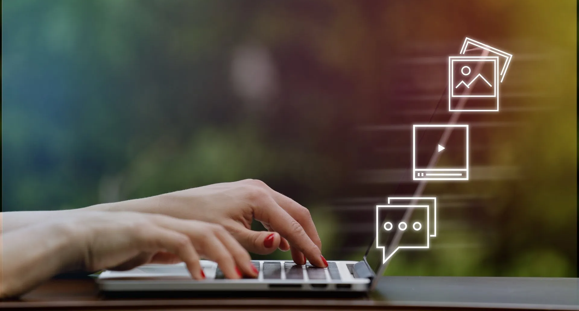 A woman is typing on a laptop computer with icons coming out of it.