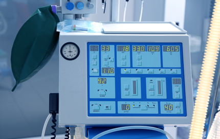 A medical device with a clock on top of it