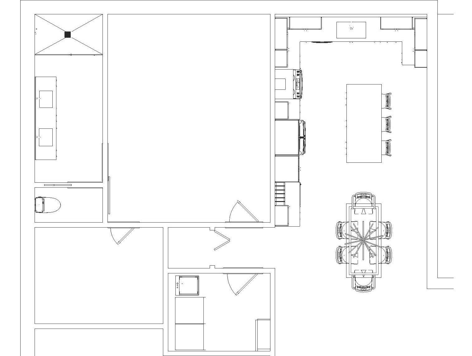 A black and white floor plan of a house with a table and chairs.