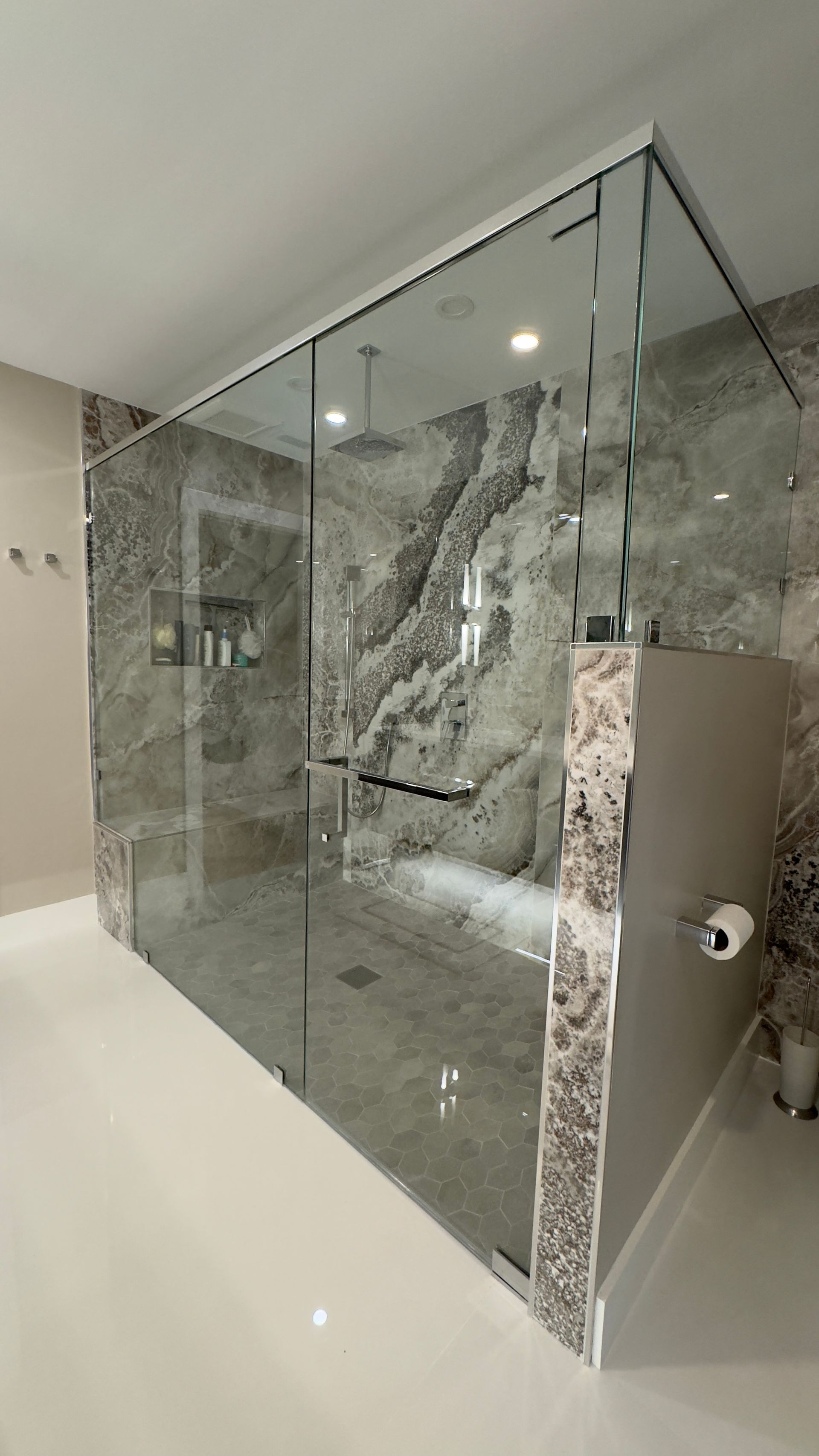 A primary bathroom with a walk in shower. 