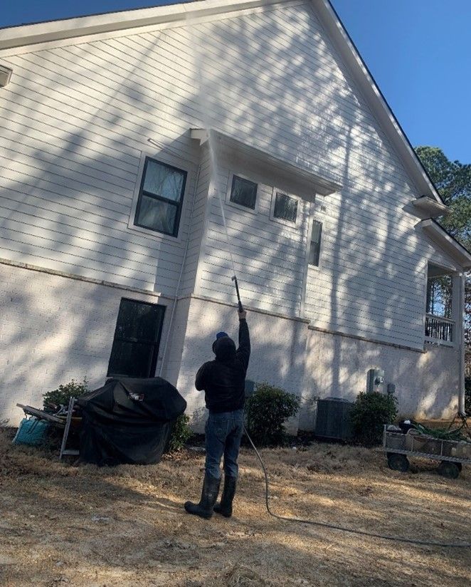 Home exterior walls being pressure washed — Chattanooga, TN — Under Pressure Pressure Washing Home exterior walls being pressure washed — Chattanooga, TN — Under Pressure Pressure Washing