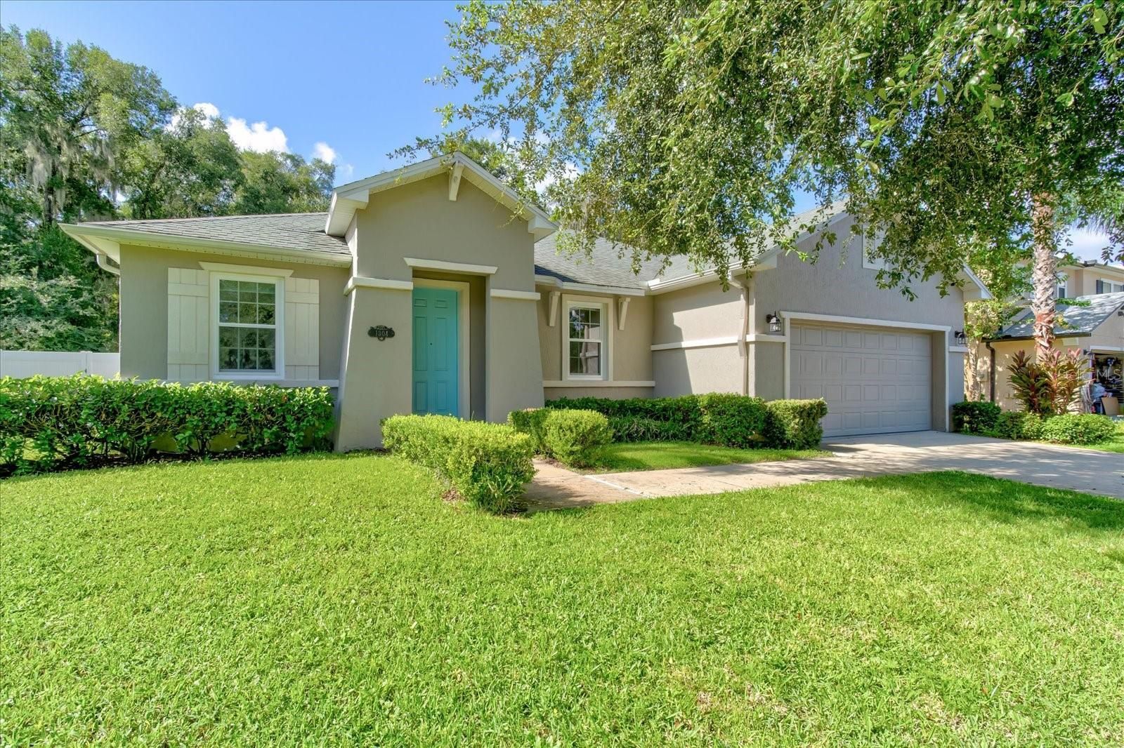 Beautiful house with bright blue door available to purchase in Central Florida.