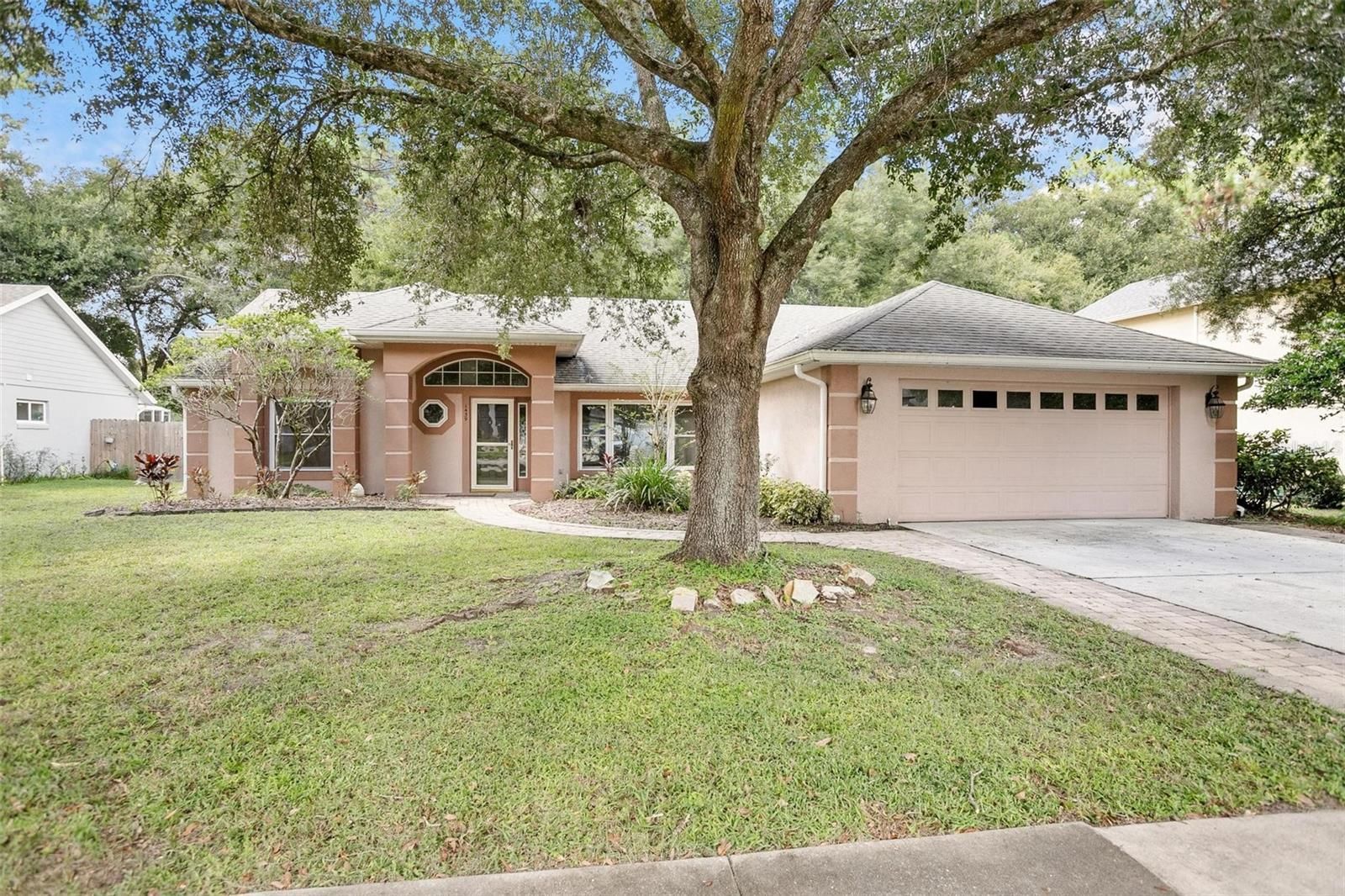 Shady trees over a stunning home for sale in Central Florida