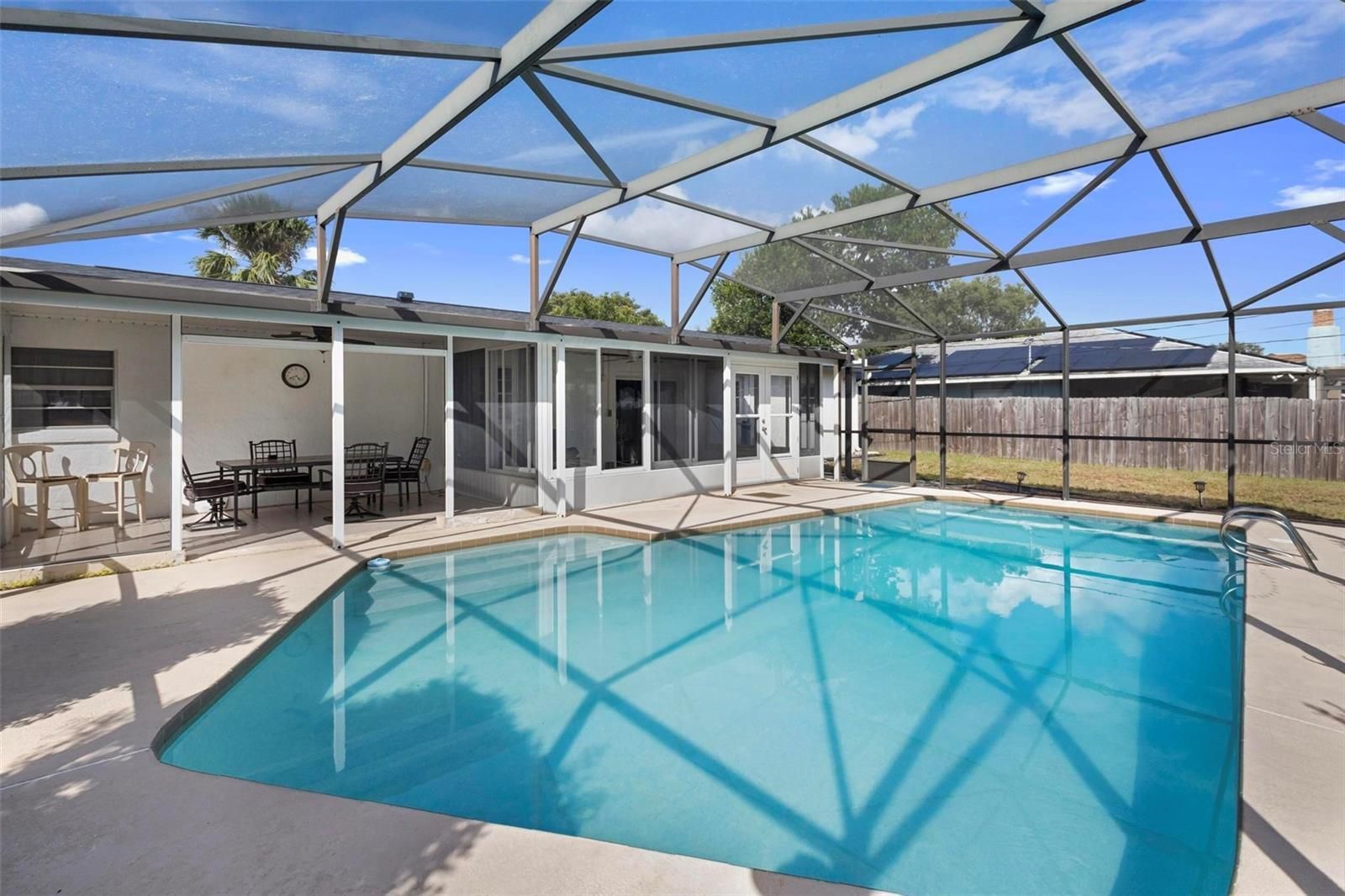 Photo of a swimming pool that is an amenity of this house for sale in Central Florida.