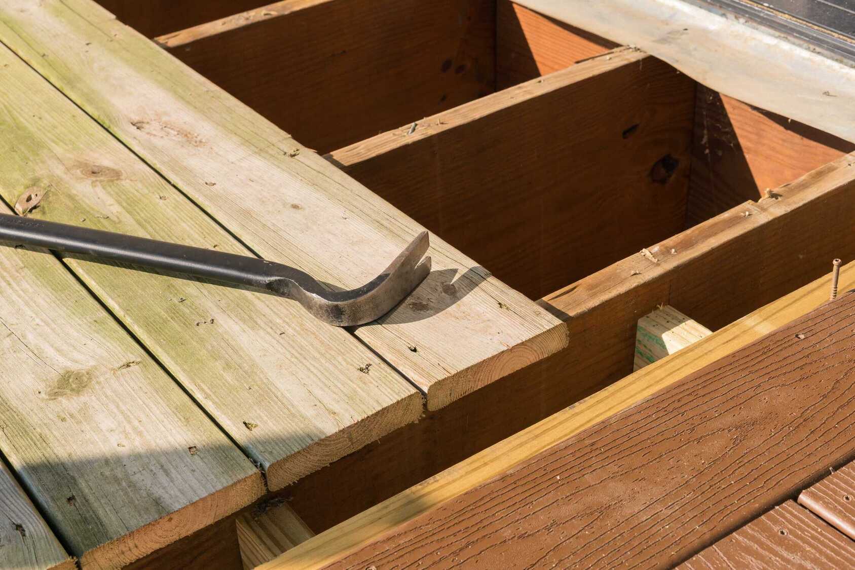 old wooden deck being repaired by Birmingham Decks crew