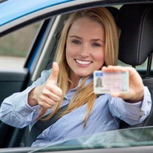 Woman in Car Showing her Drivers License - Broome County, NY