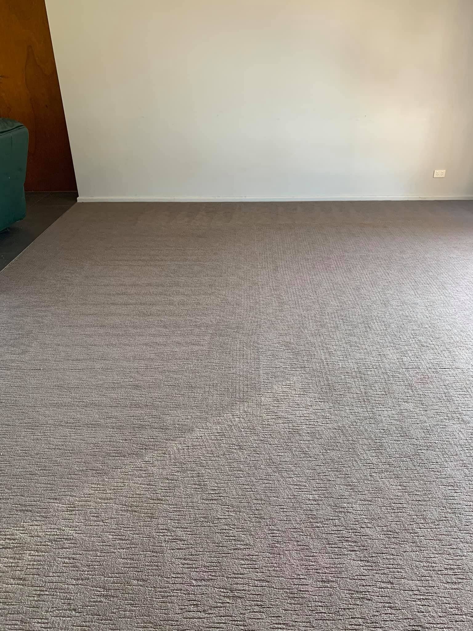 Empty Room With a Light Beige Carpet
