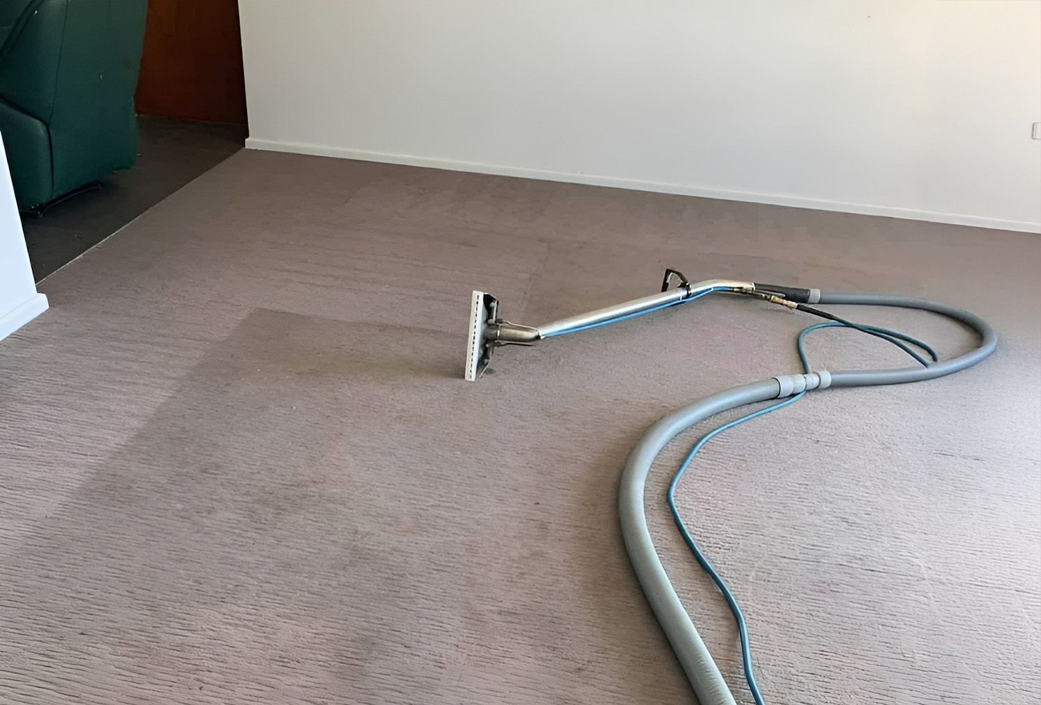 Carpet Being Cleaned With A Steam Cleaner