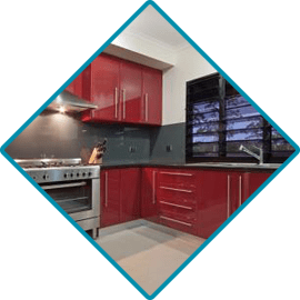 Custom Red Cabinetry in Kitchen— Cabinet Design in Berrimah, NT