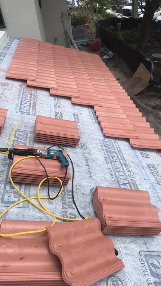 Tile roofing materials staged during installation by Nations Roofing & Construction in Dade City, Florida