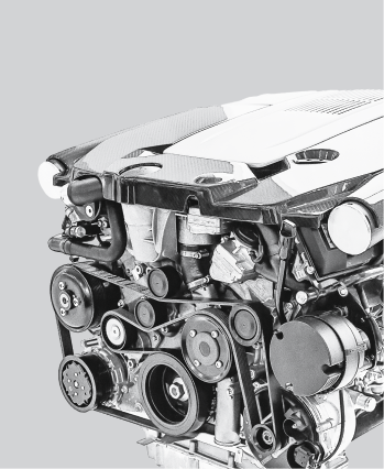 Car engine with belts, pulleys, and accessories, viewed from the side | The SouthSide Garage