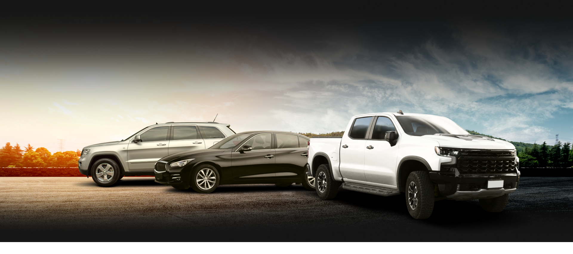 Three vehicles, SUV, sedan, and pickup truck, parked on a paved surface, against a cloudy sky background | The SouthSide Garage