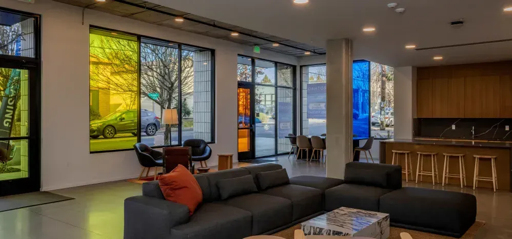 Photo of the building lobby showing tinted glass and various seating areas