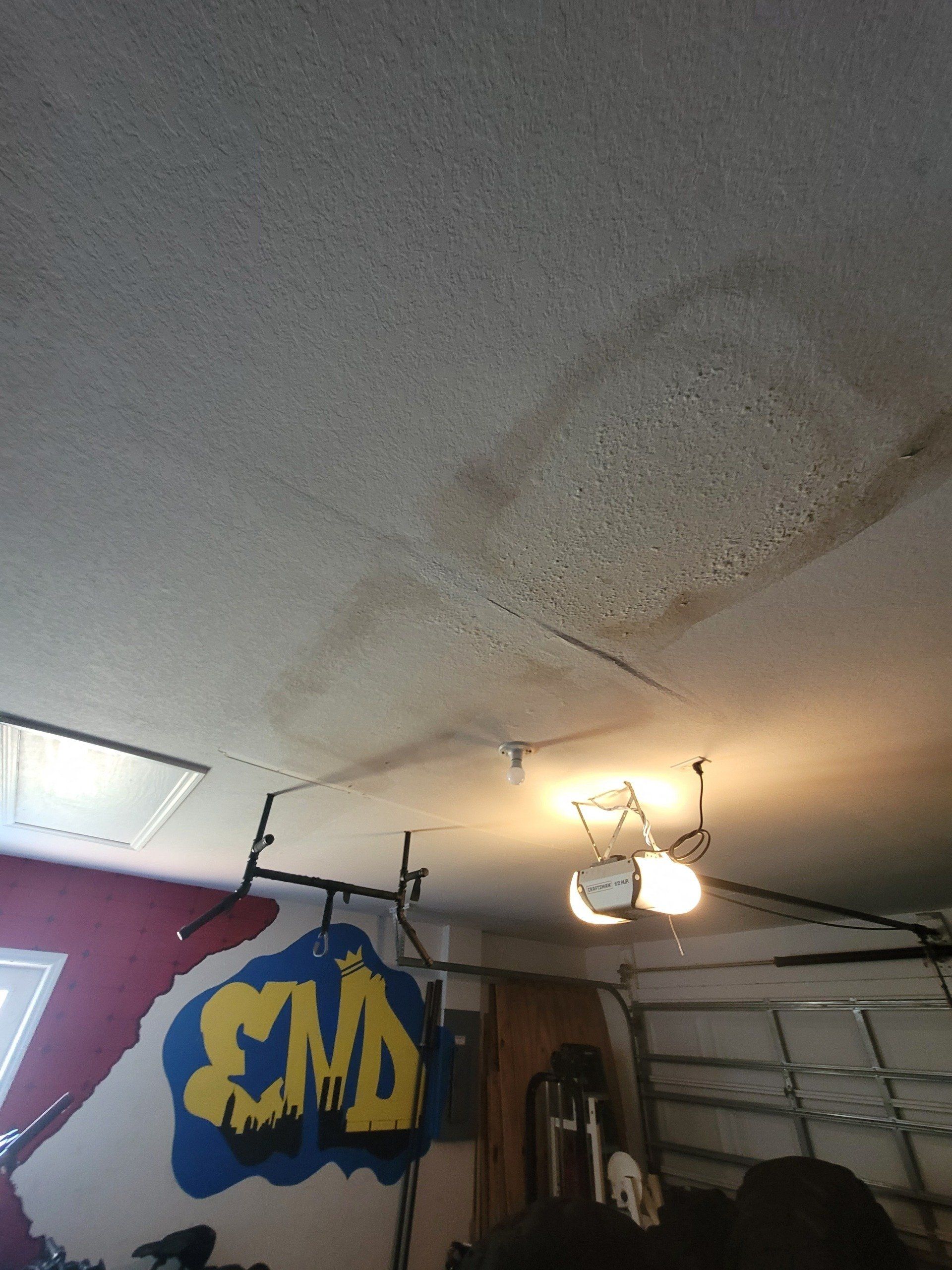 A ceiling in a garage with a sign that says smd on it