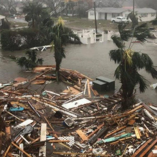 A pile of rubble in the middle of a flooded area