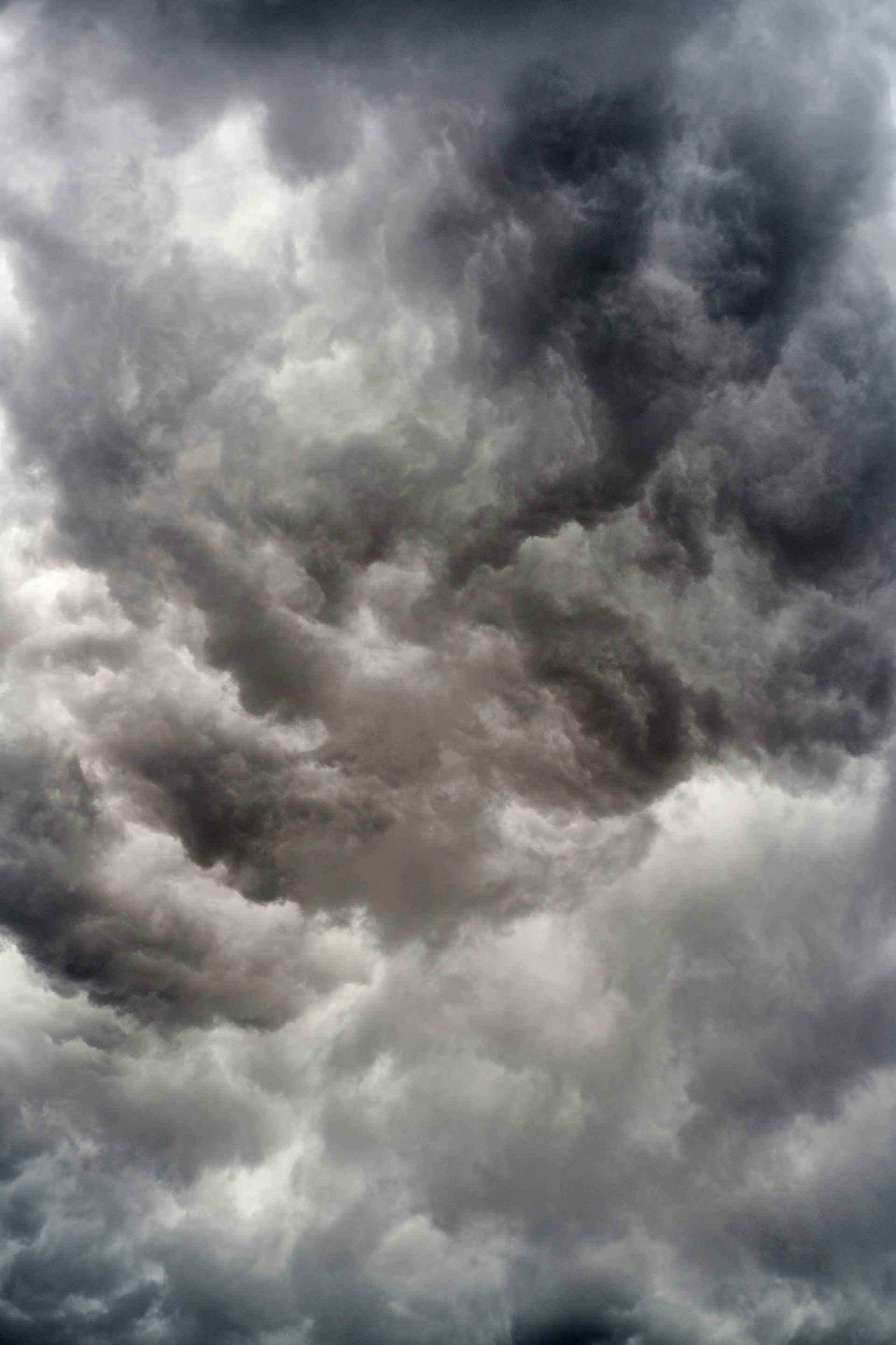 A black and white photo of a cloudy sky