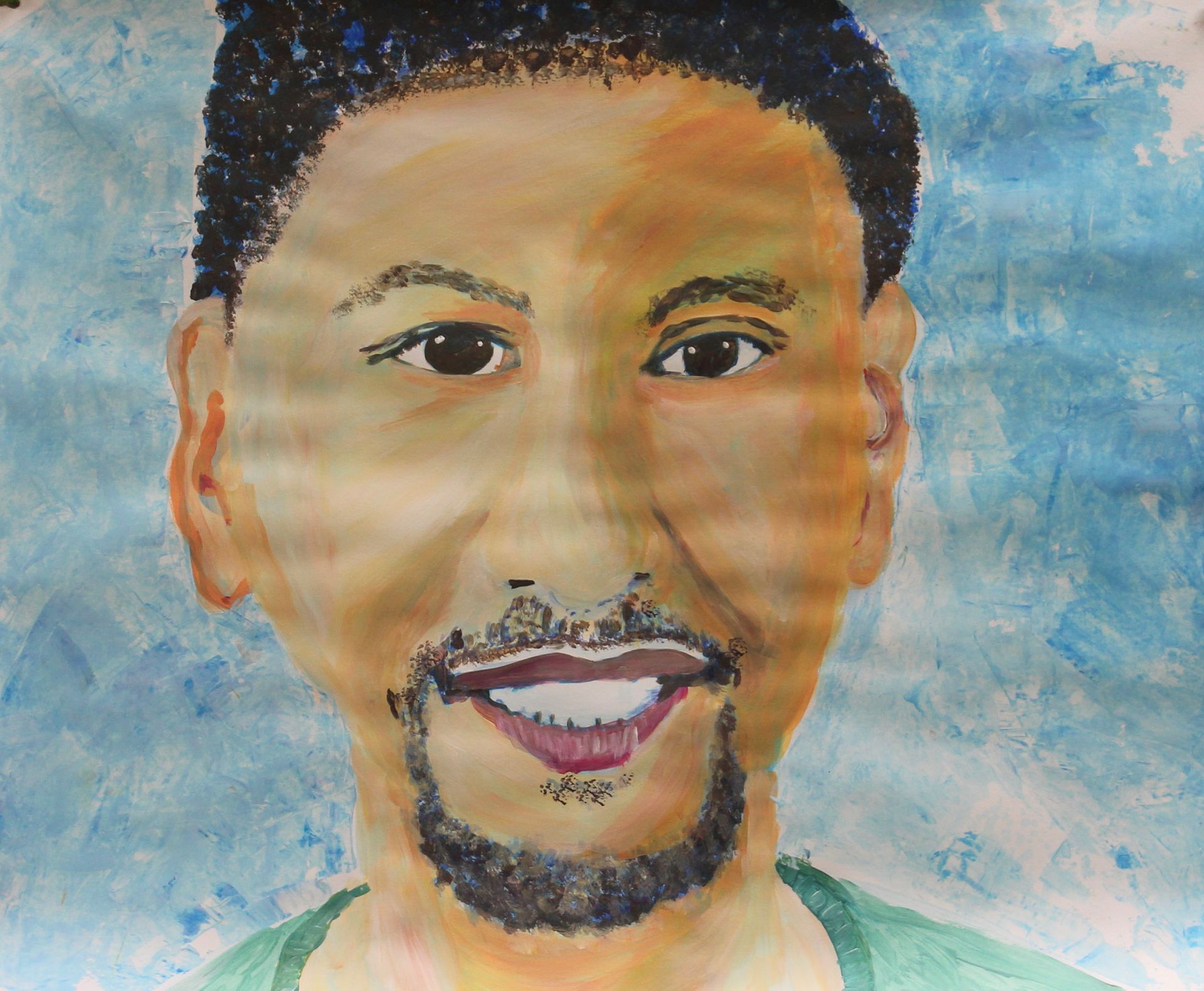 Een schilderij van een lachende man met een baard