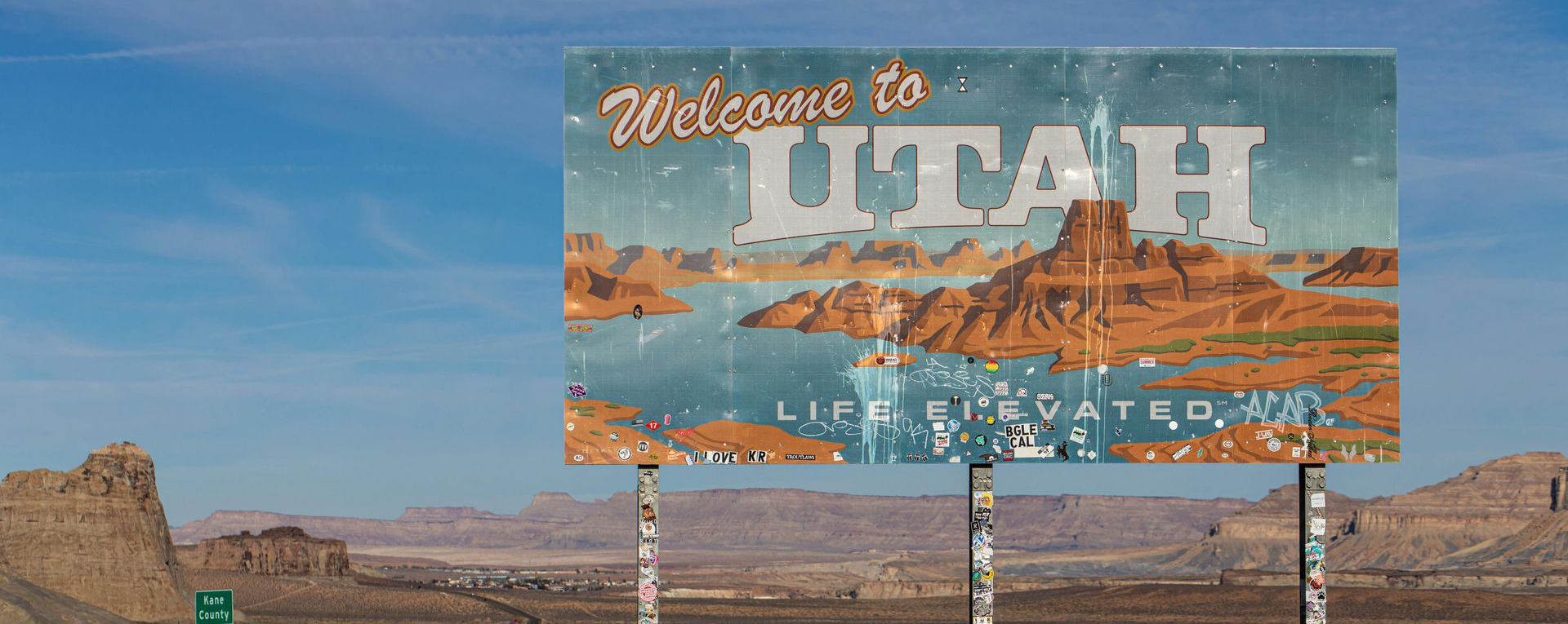 Welcome to Utah roadside sign in the desert landscape of southern Utah