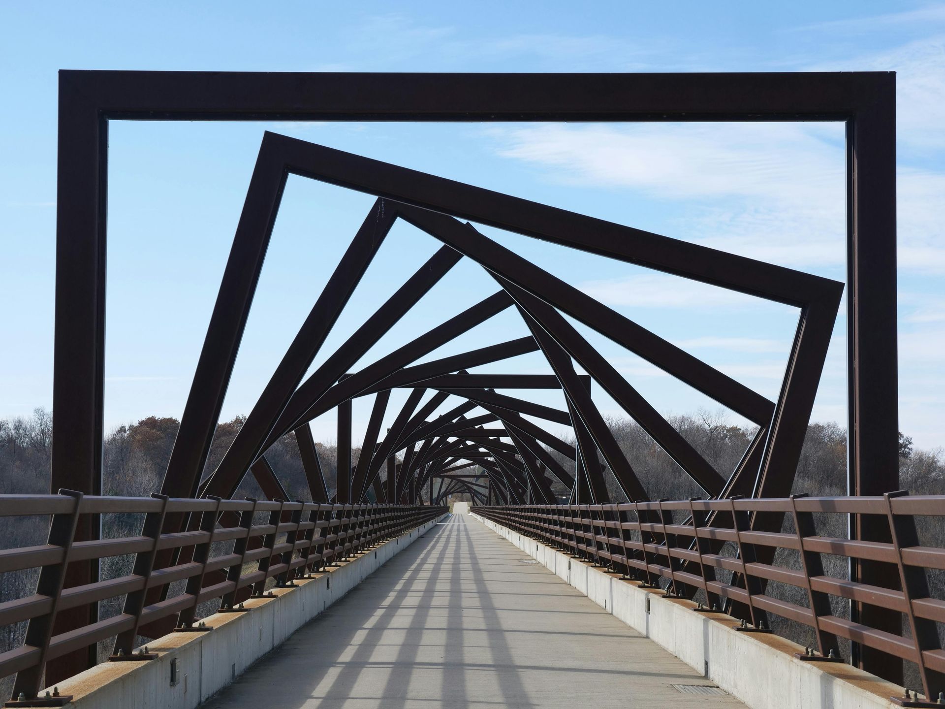 High Trestle Trail Bridge illuminated at night over the Des Moines River valley.