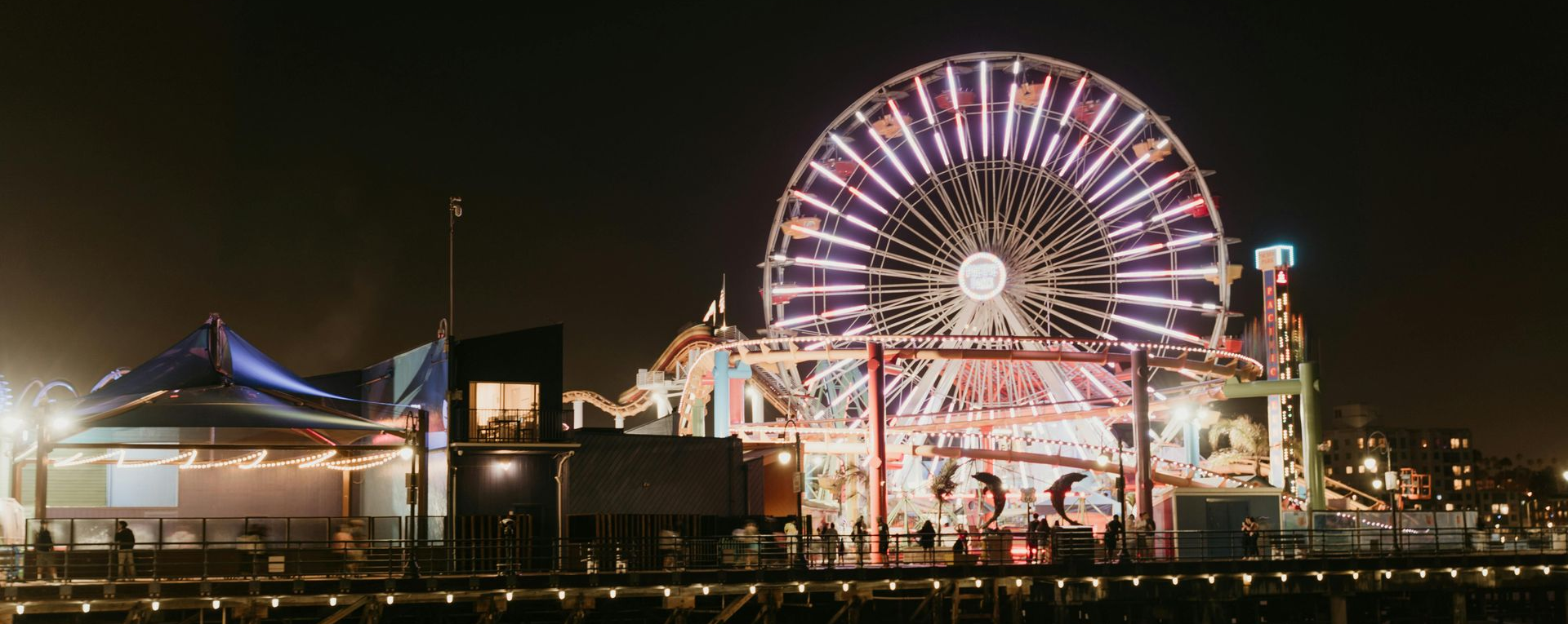 Santa Monica Pier with Ferris wheel along the California coastline.