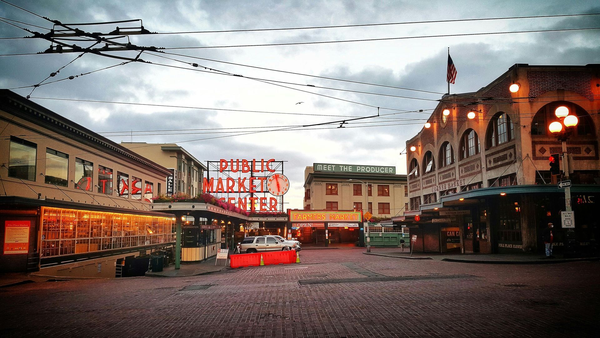 Pike Place Market entrance with the Public Market Center neon sign in downtown Seattle Washington.