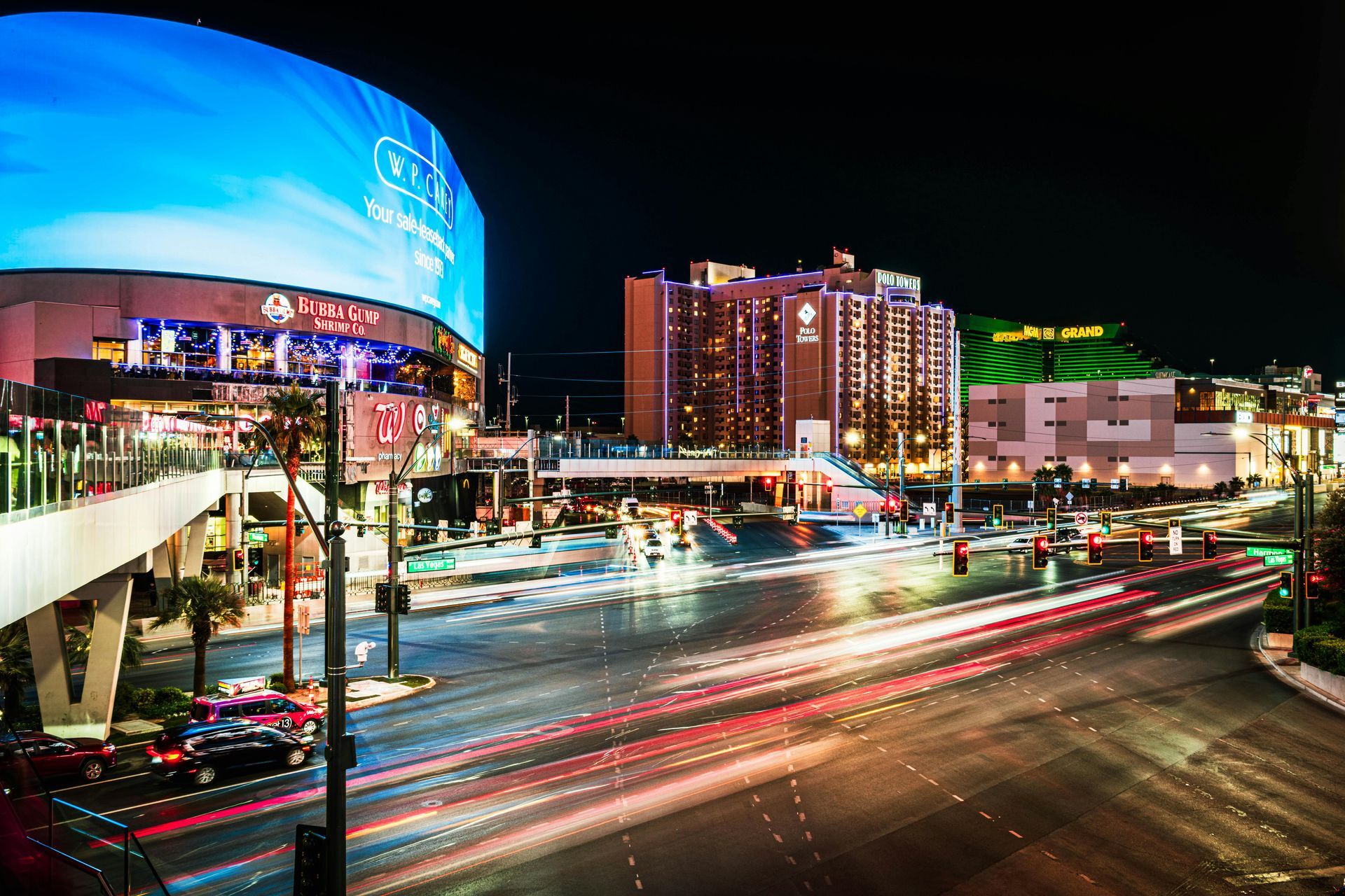 Las Vegas strip at night with cars driving