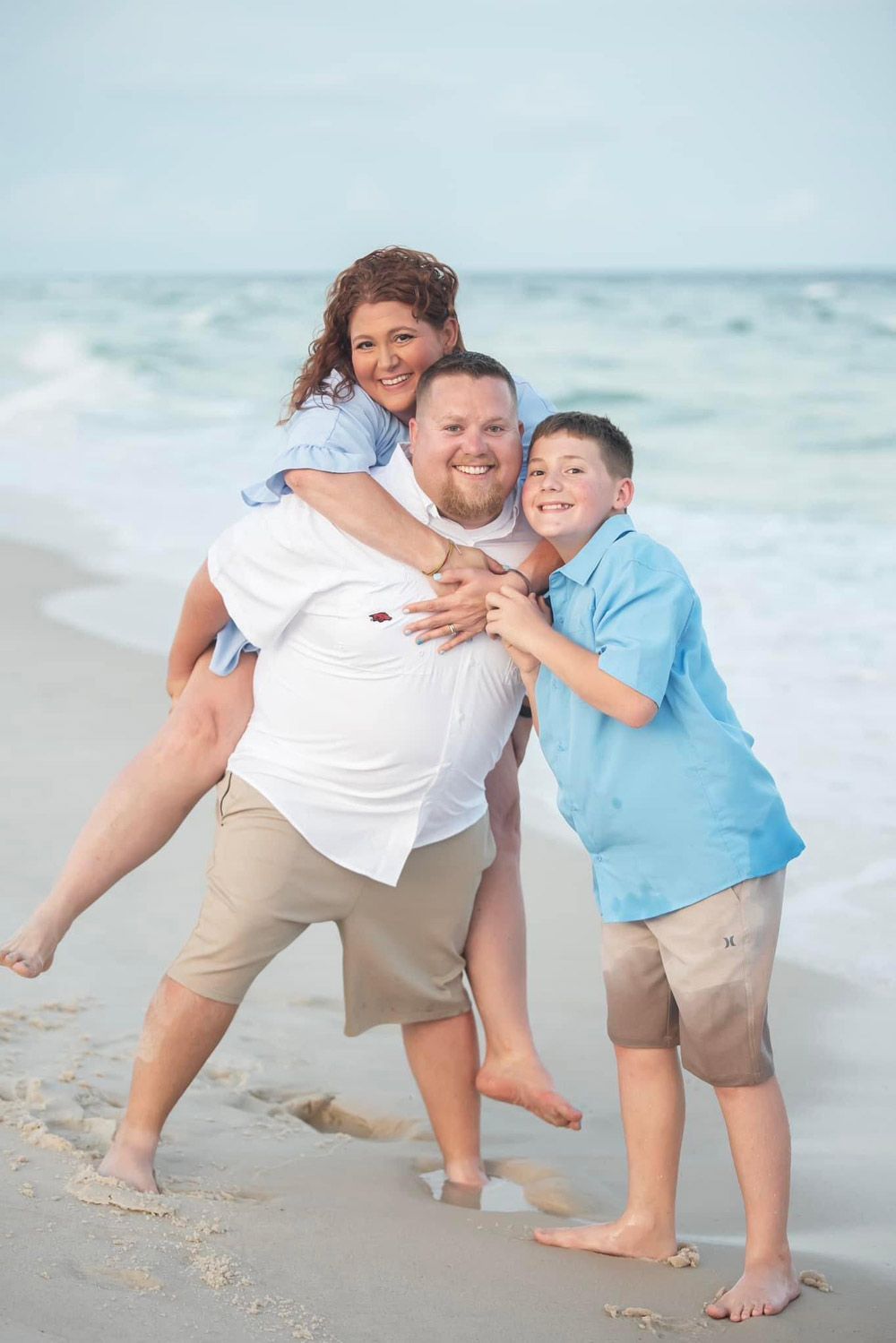 Kelby and Erin Winberry of M&W Outdoor Services in NWA at the beach